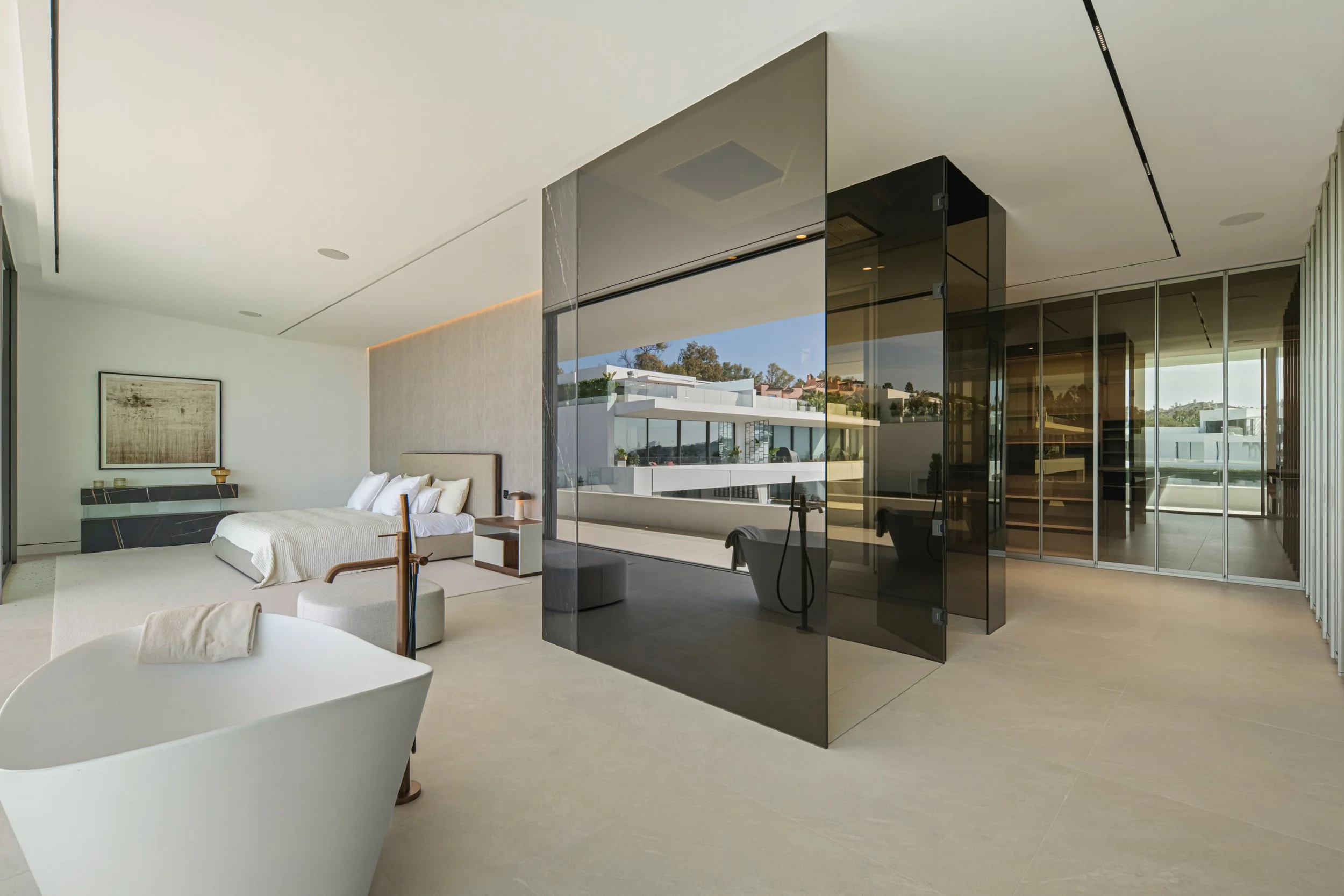 Luxury bedroom layout featuring a freestanding designer bathtub positioned to capture coastal views.