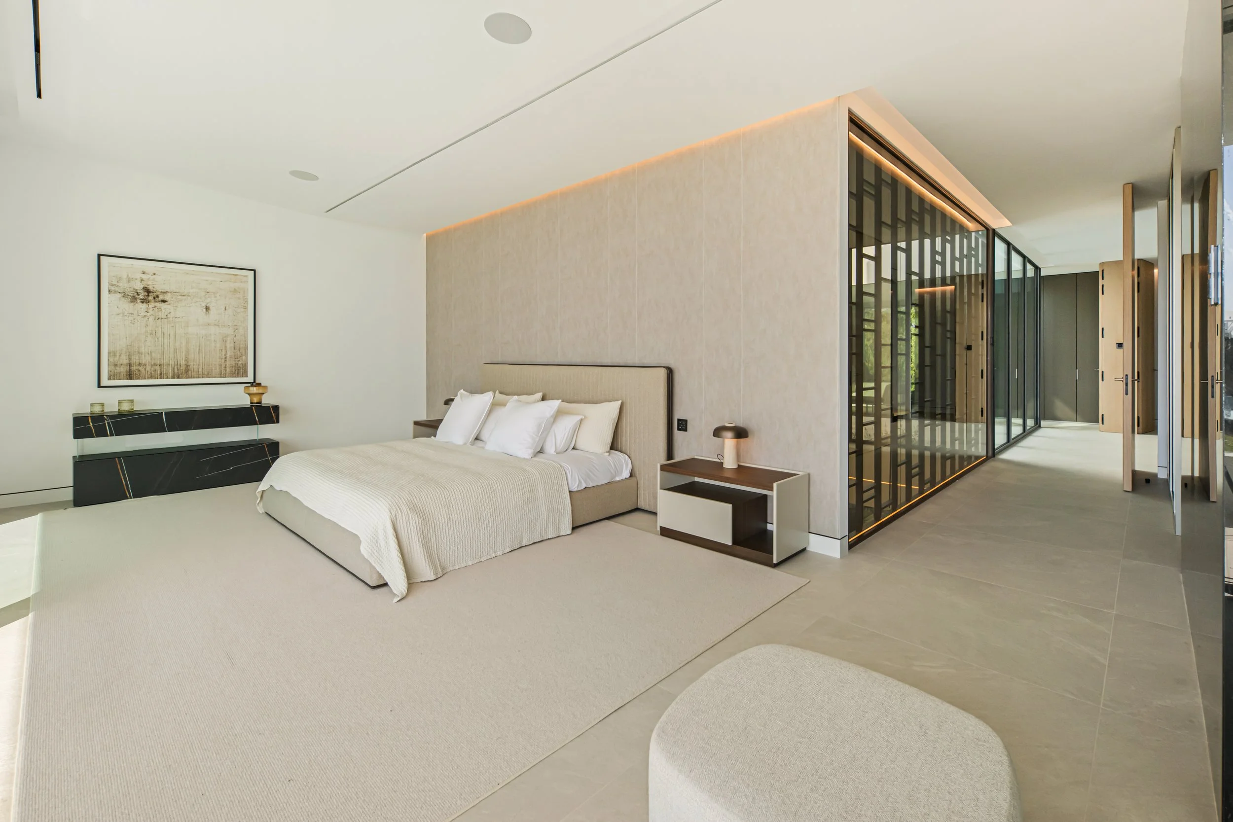 rene master suite with floor-to-ceiling windows, minimalist decor, and direct access to the garden