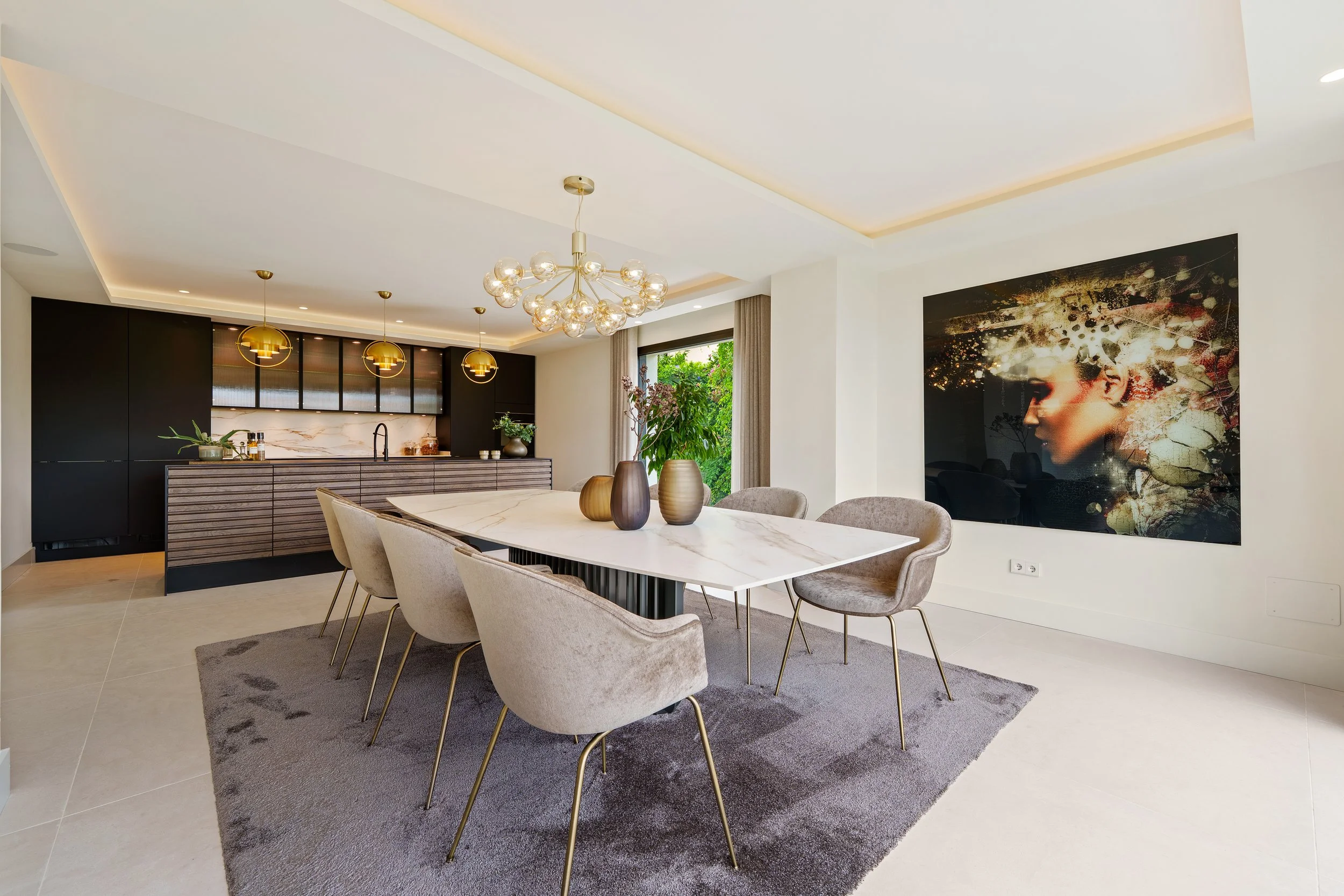 Bright dining space seamlessly connecting the interior to the manicured grounds