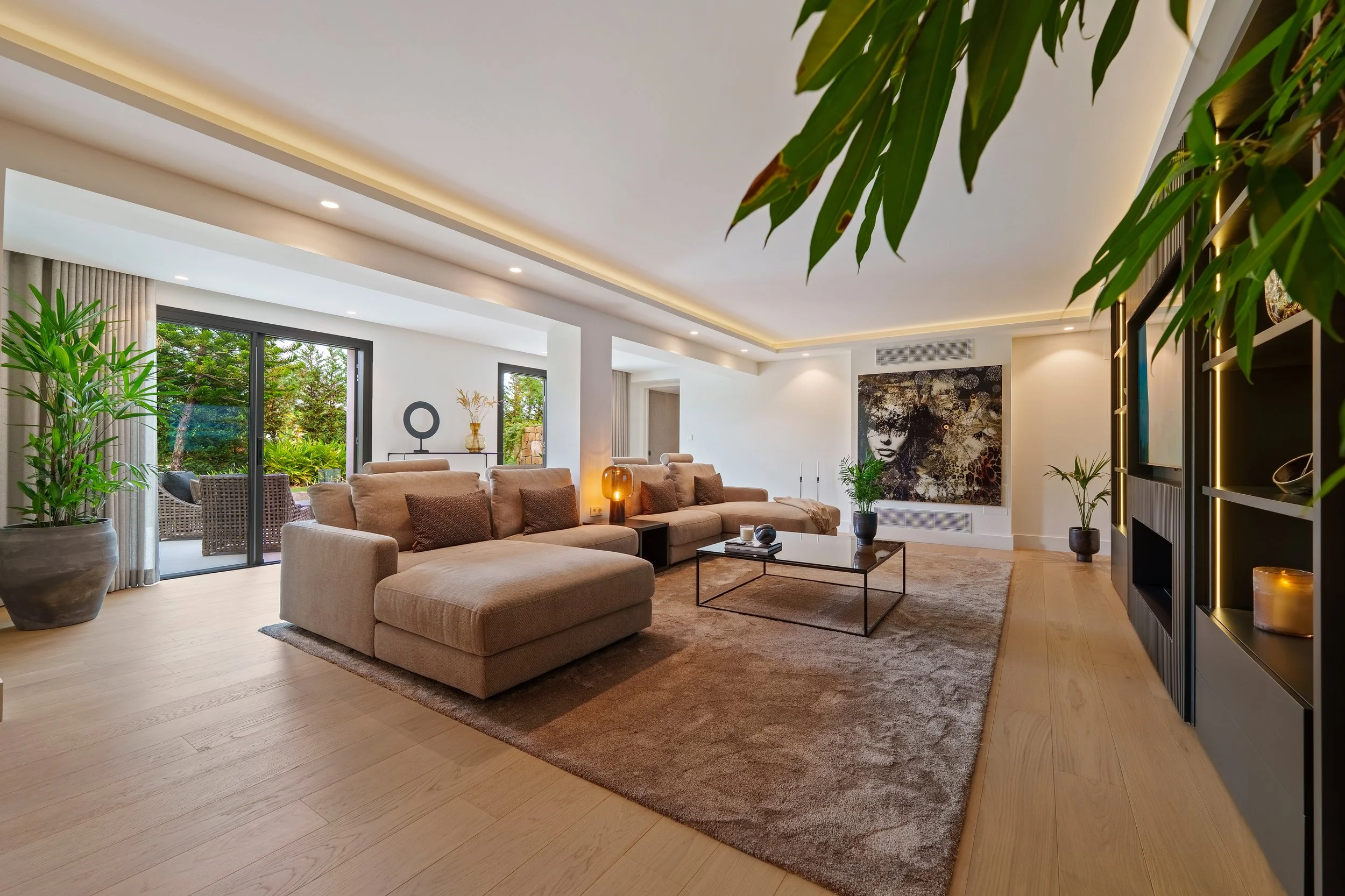 pacious living room featuring Scandinavian elegance and floor-to-ceiling glass.
