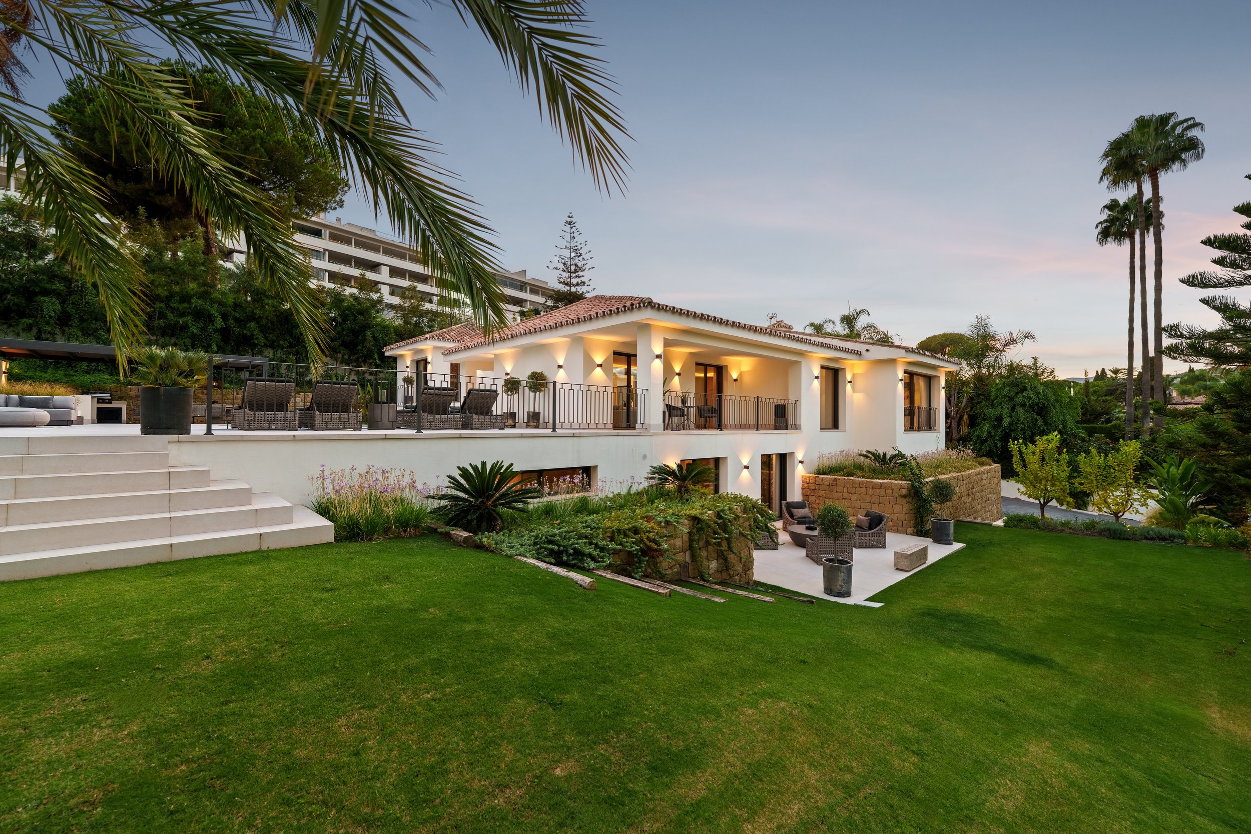 Lush private garden and modern villa exterior in Nueva Andalucia.