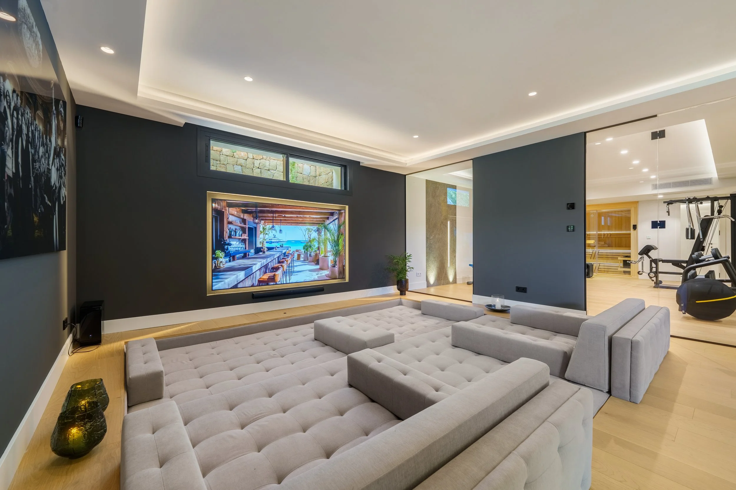 High-tech home cinema room with sunken seating for the ultimate movie night.