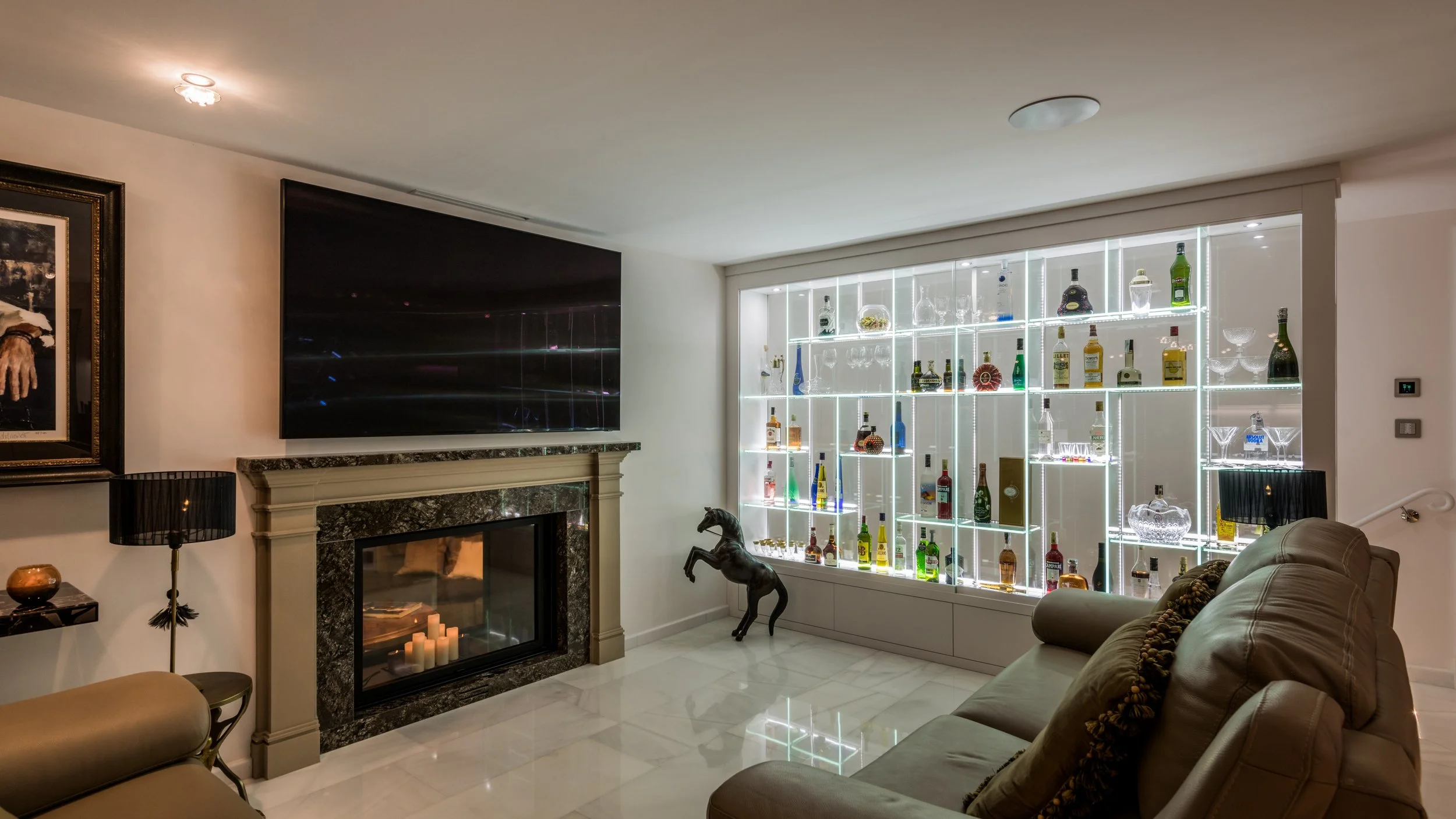 Luxury basement entertainment lounge in Marbella with stone fireplace private bar area and exposed wooden beams Ref CMH2440