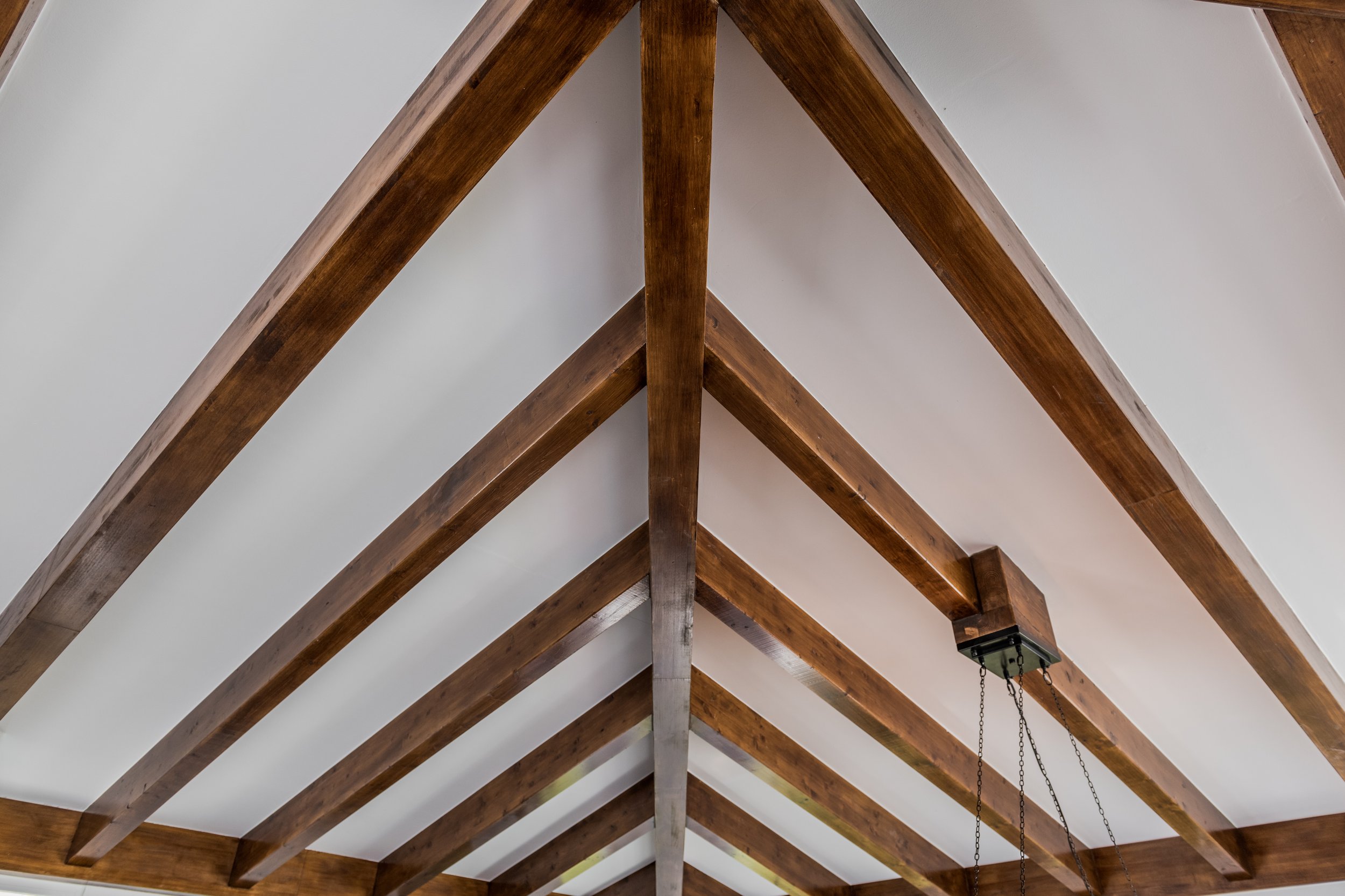 Luxury basement entertainment lounge in Marbella with stone fireplace private bar area and exposed wooden beams Ref CMH2440