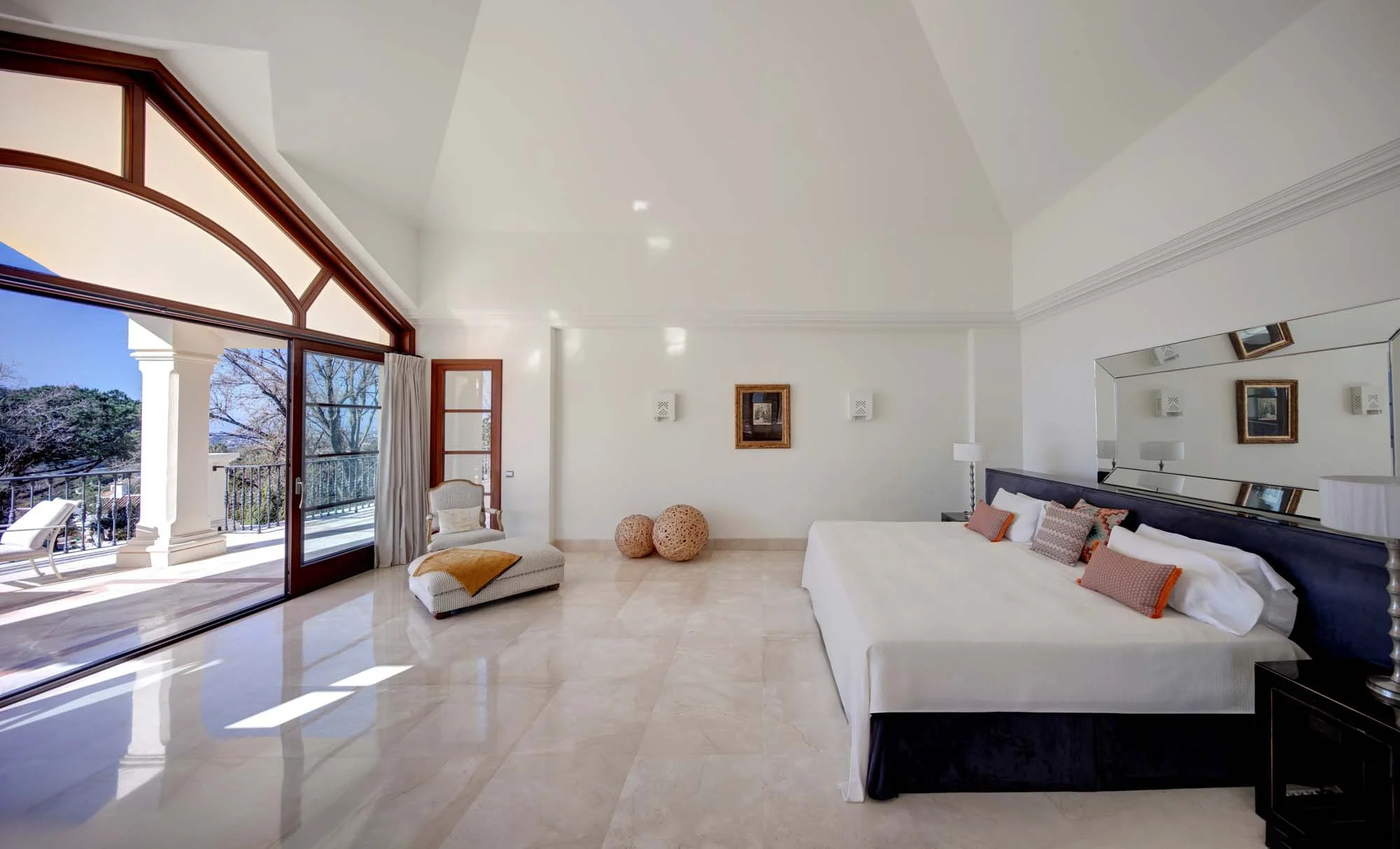 Ultra-private main bedroom suite with high vaulted ceilings and panoramic sea-view terrace access.