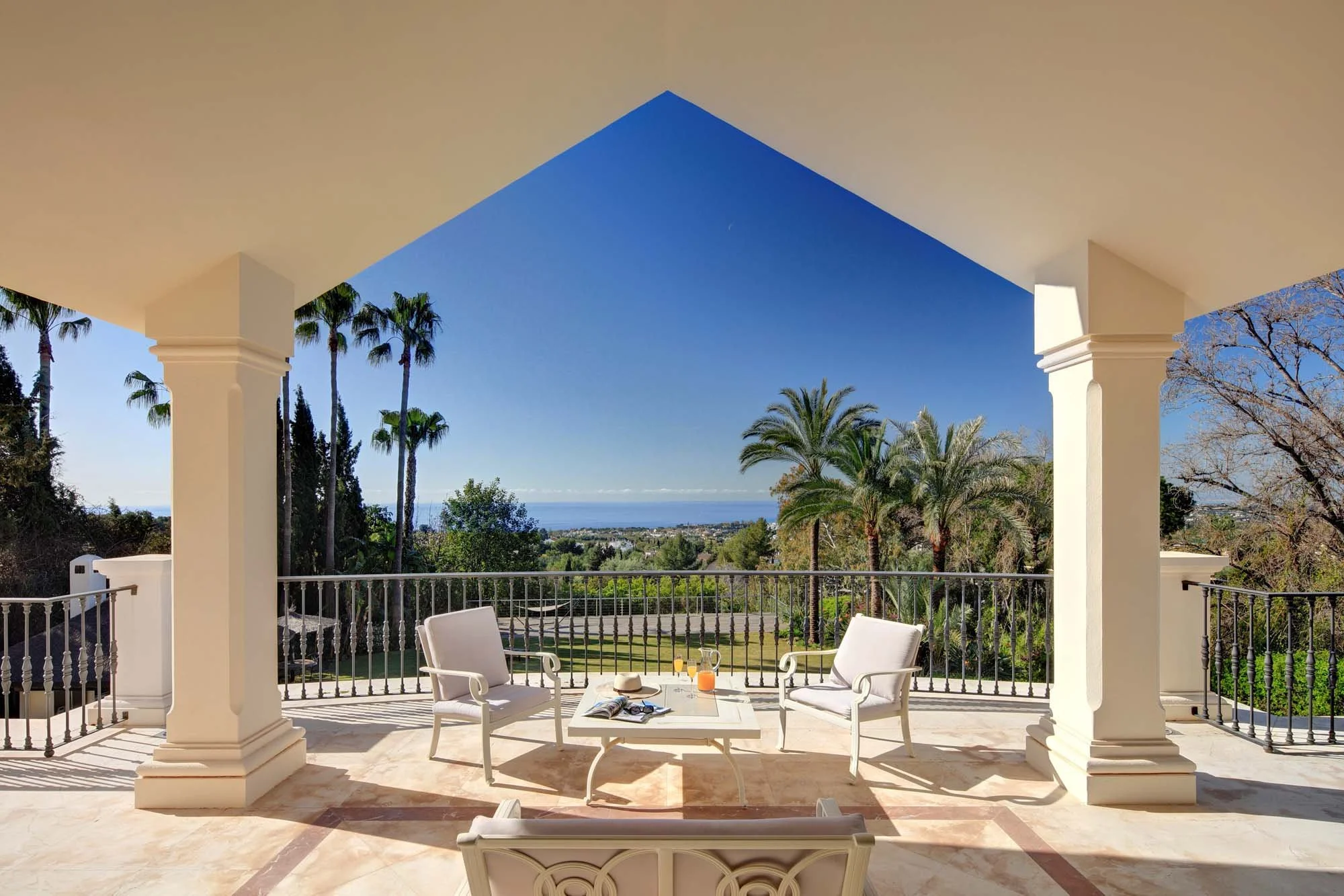 Panoramic coastal views toward the Mediterranean Sea from a luxury covered upper terrace.