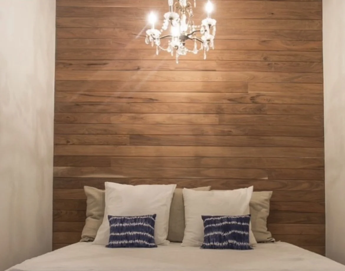 We used wood panelling in the daybed nooks and bathrooms, a lovely backdrop for the vintage chandeliers.