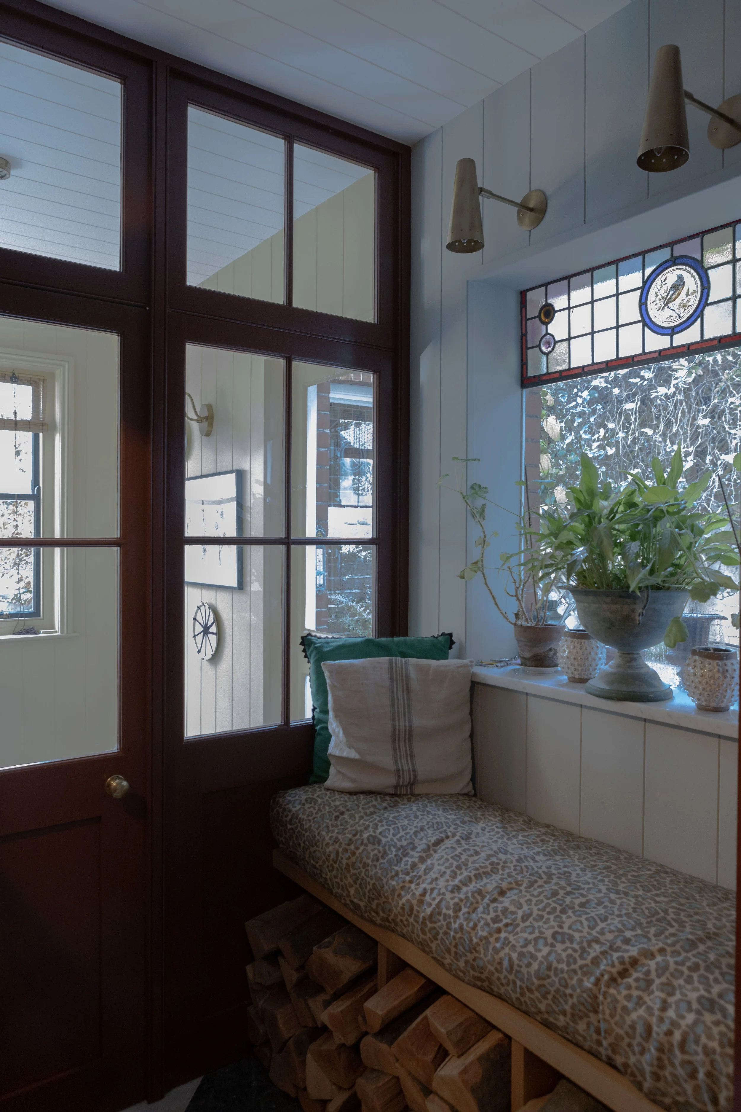 The colour palette in sumptuous, warm browns and reds create atmosphere. We used Beata Heuman’s London Brick for the floor to ceiling hallway cupboards and kitchen shelf. Little Green’s Purple Brown for the kitchen drawers and Arras for the doors and