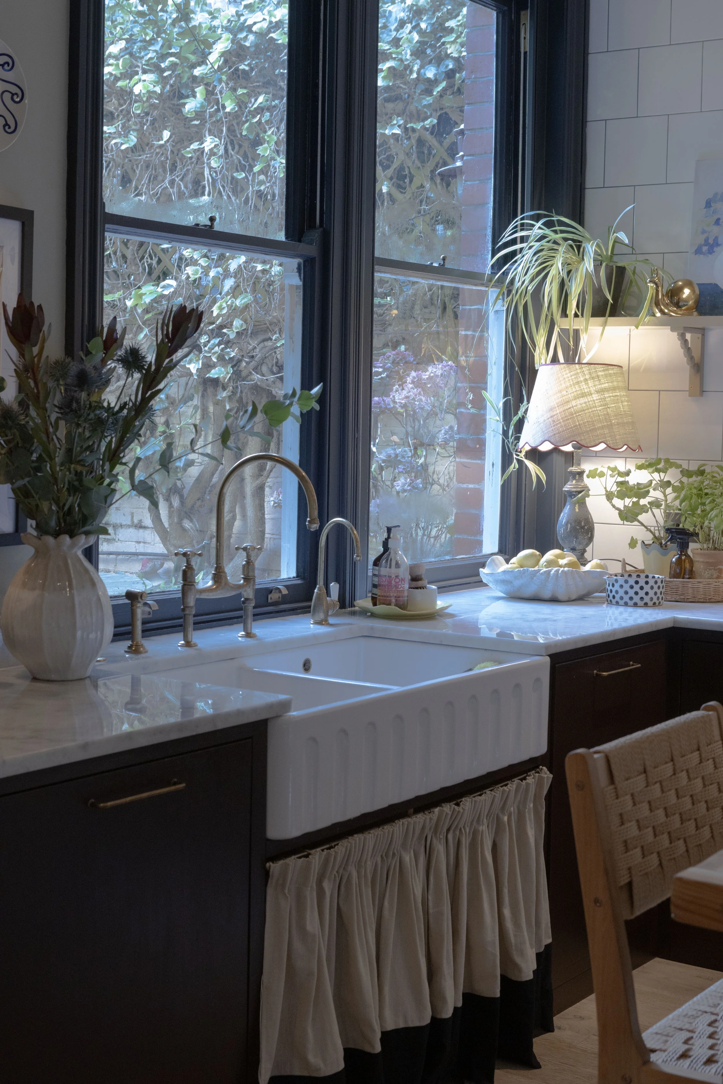 Kitchen sink cabinet has linen skirting which breaks up the joinery and is another playful nod. 
