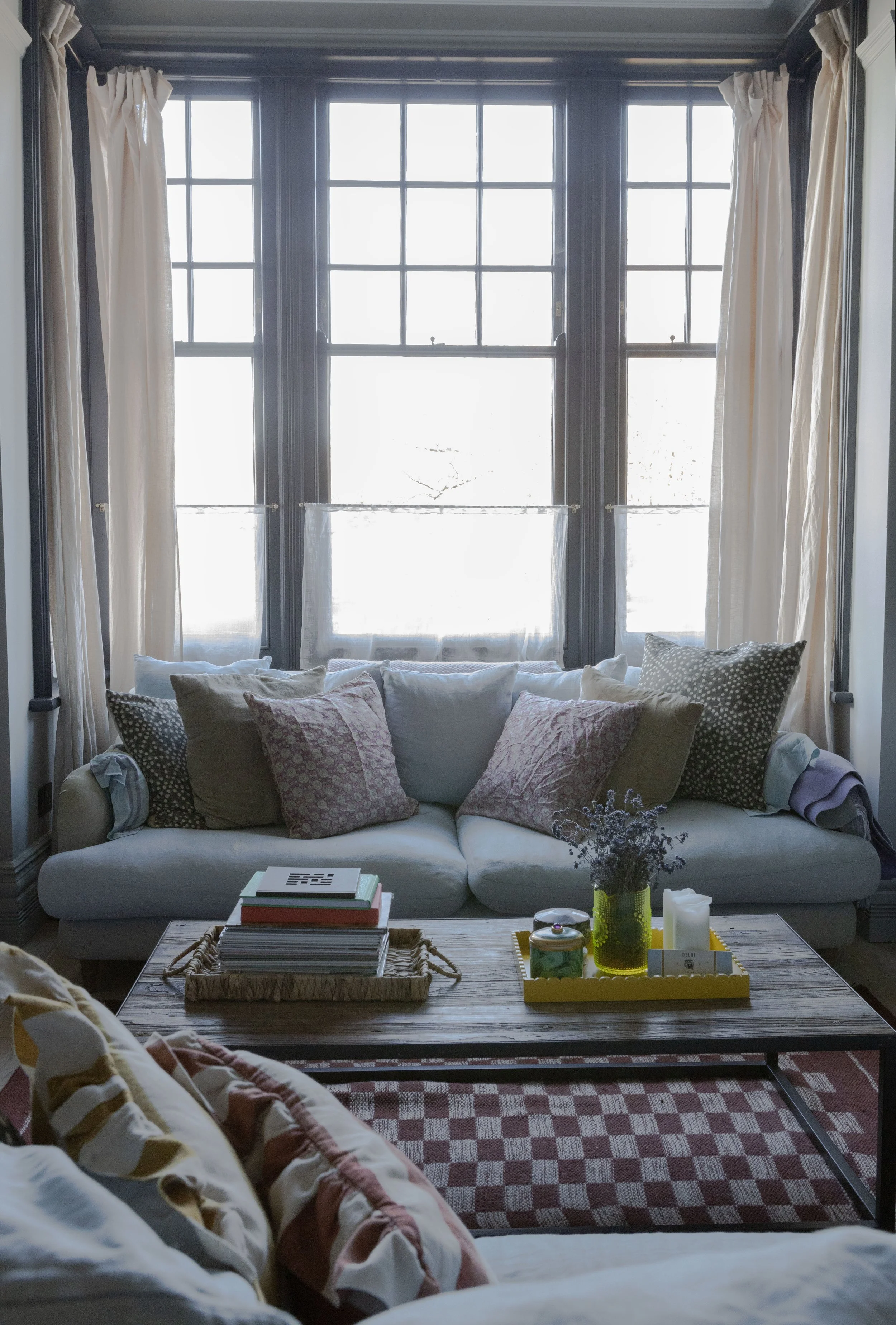 The family sitting room was colour drenched in Farrow & Ball’s Light Blue. It is very cocooning as a result yet retains a chic, smarter feel. The room has pieces from all eras and price points. 