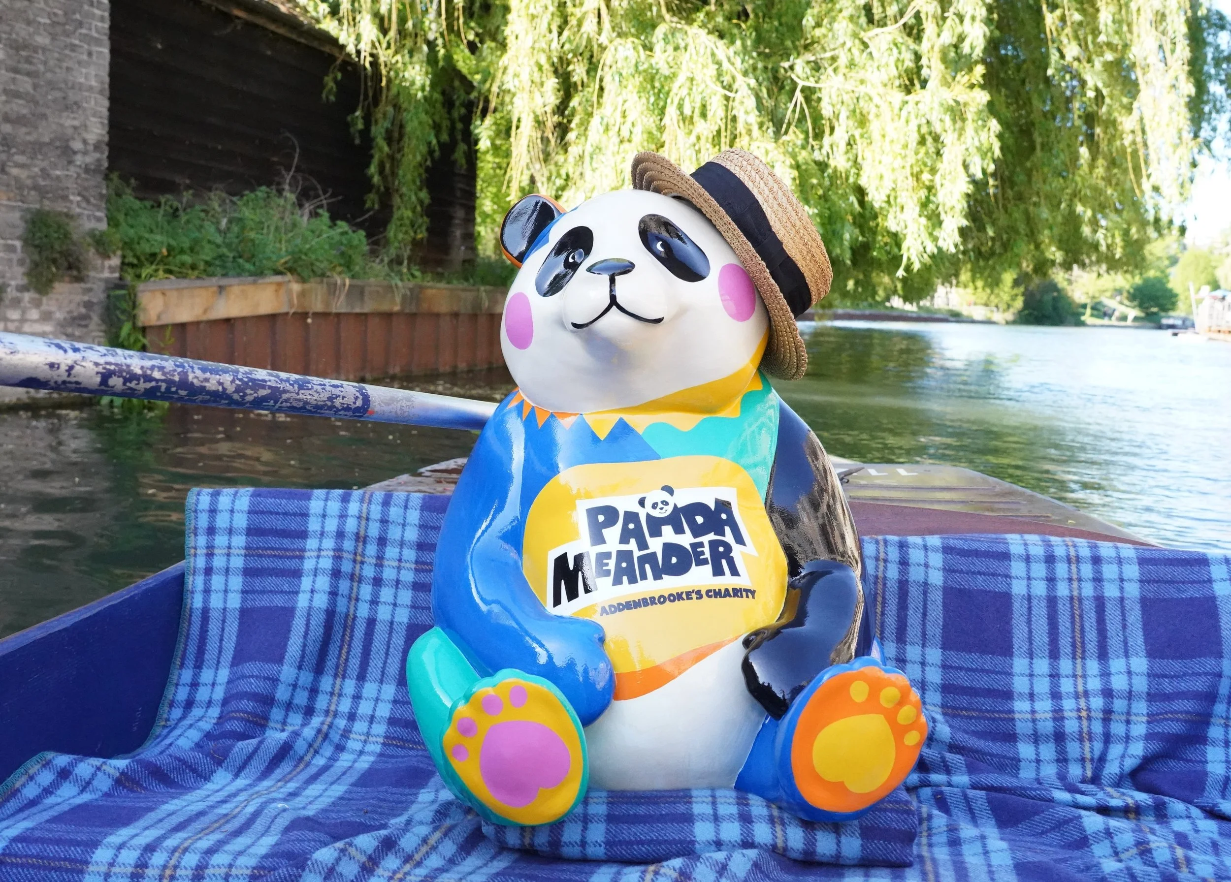 Panda sculpture sitting on a punt