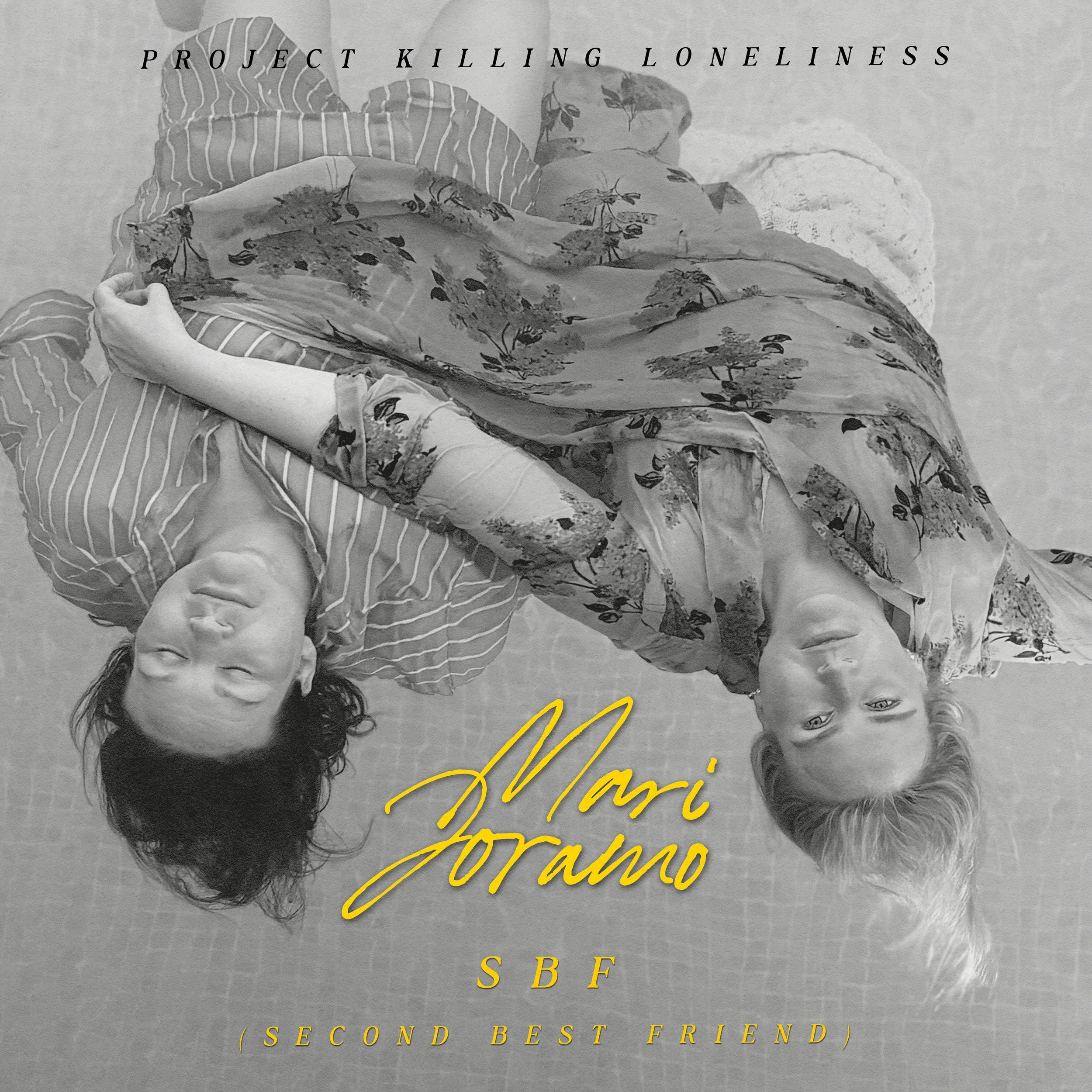 Black and white photo of two women lying down, one with dark curly hair and the other with light straight hair, both wearing patterned clothes. Text overlays include 'Project Killing Loneliness,' 'Mari Joramo,' 'SBF,' and '(Second Best Friend).'