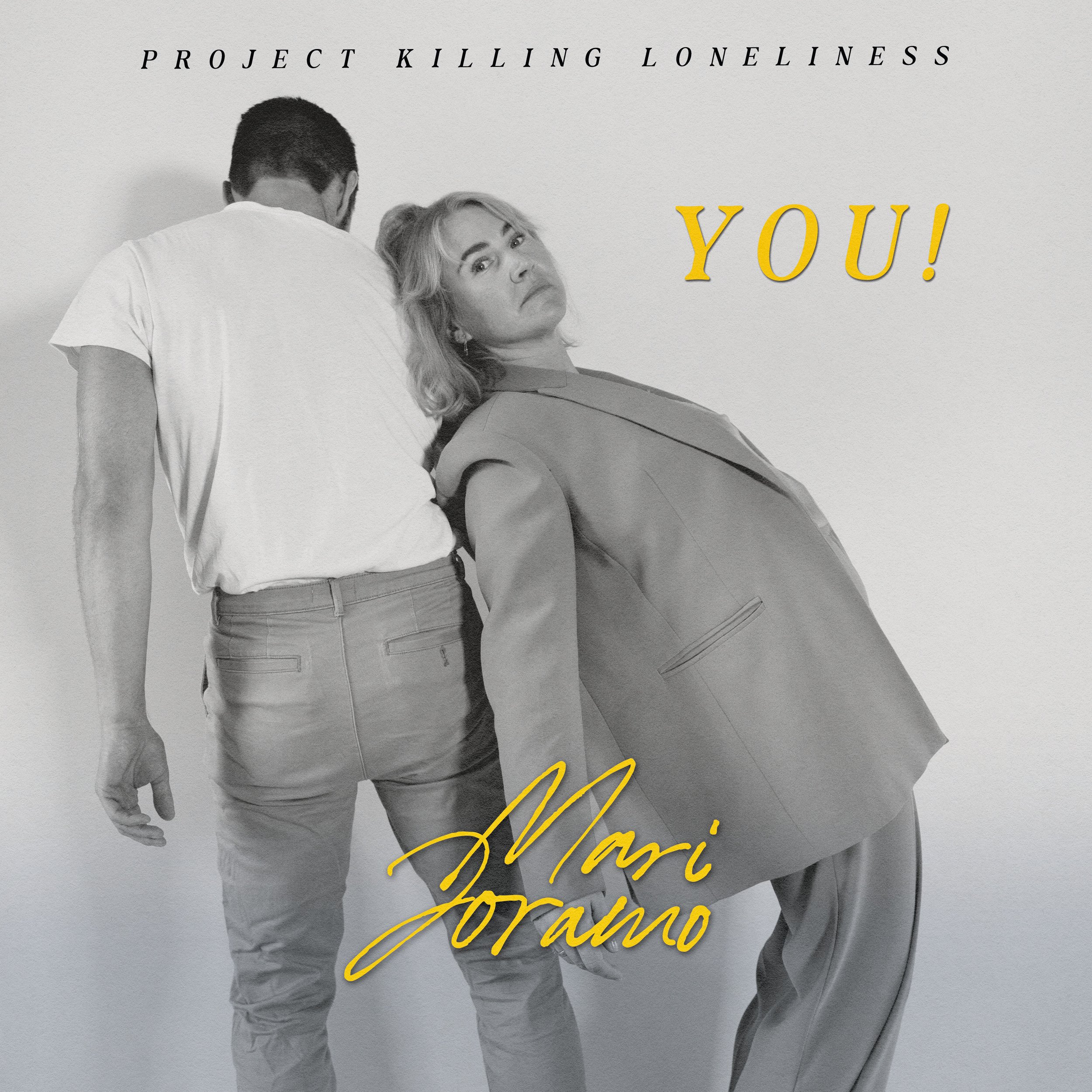 Black and white photo of a man with his back to the camera leaning against a blonde woman who is looking directly at the camera. The woman is wearing a blazer and has a serious expression. Text on the image includes 'PROJECT KILLING LONELINESS,' 'YOU!,'