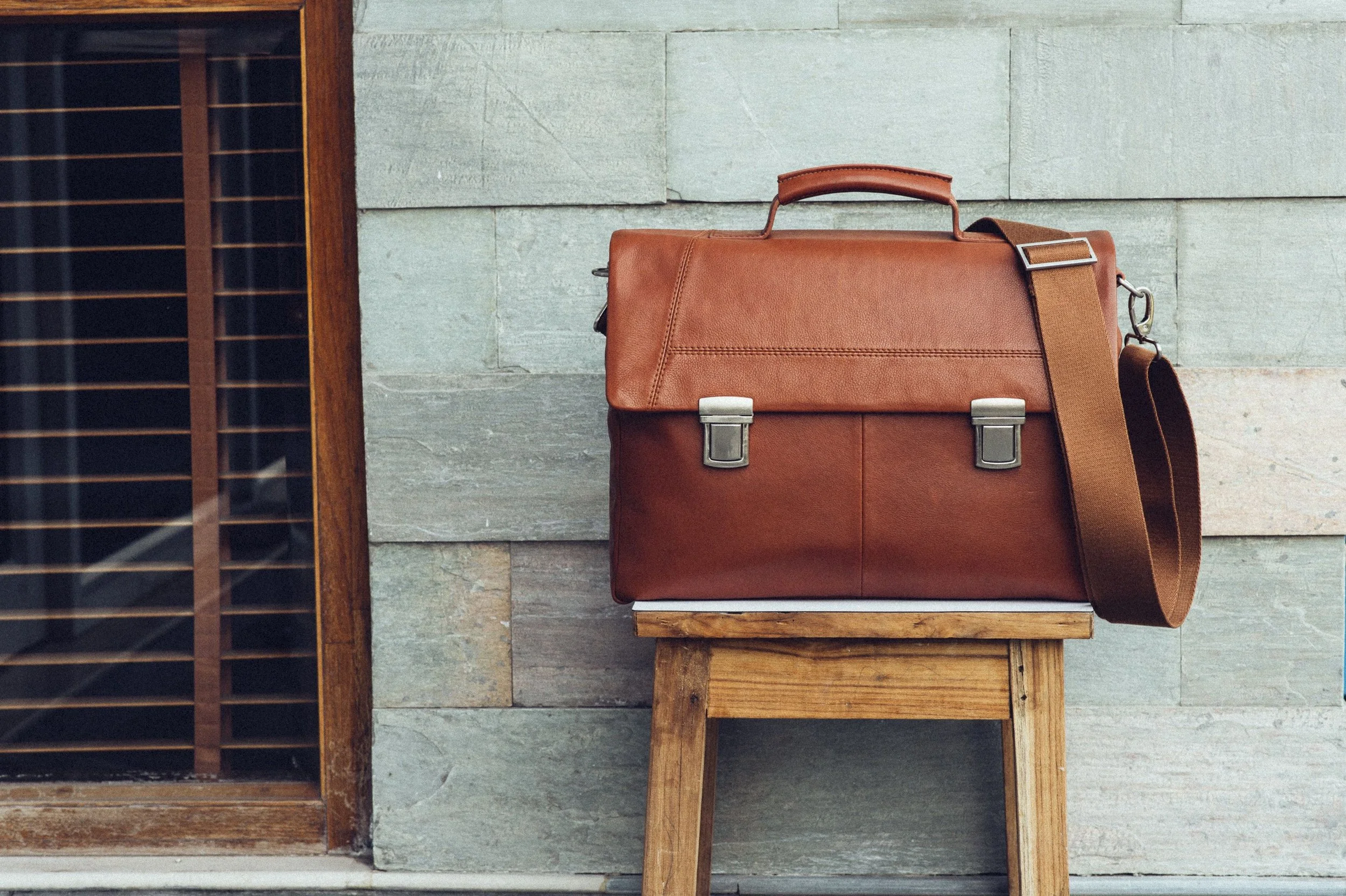 Tan Leather Briefcase with silver finishings.