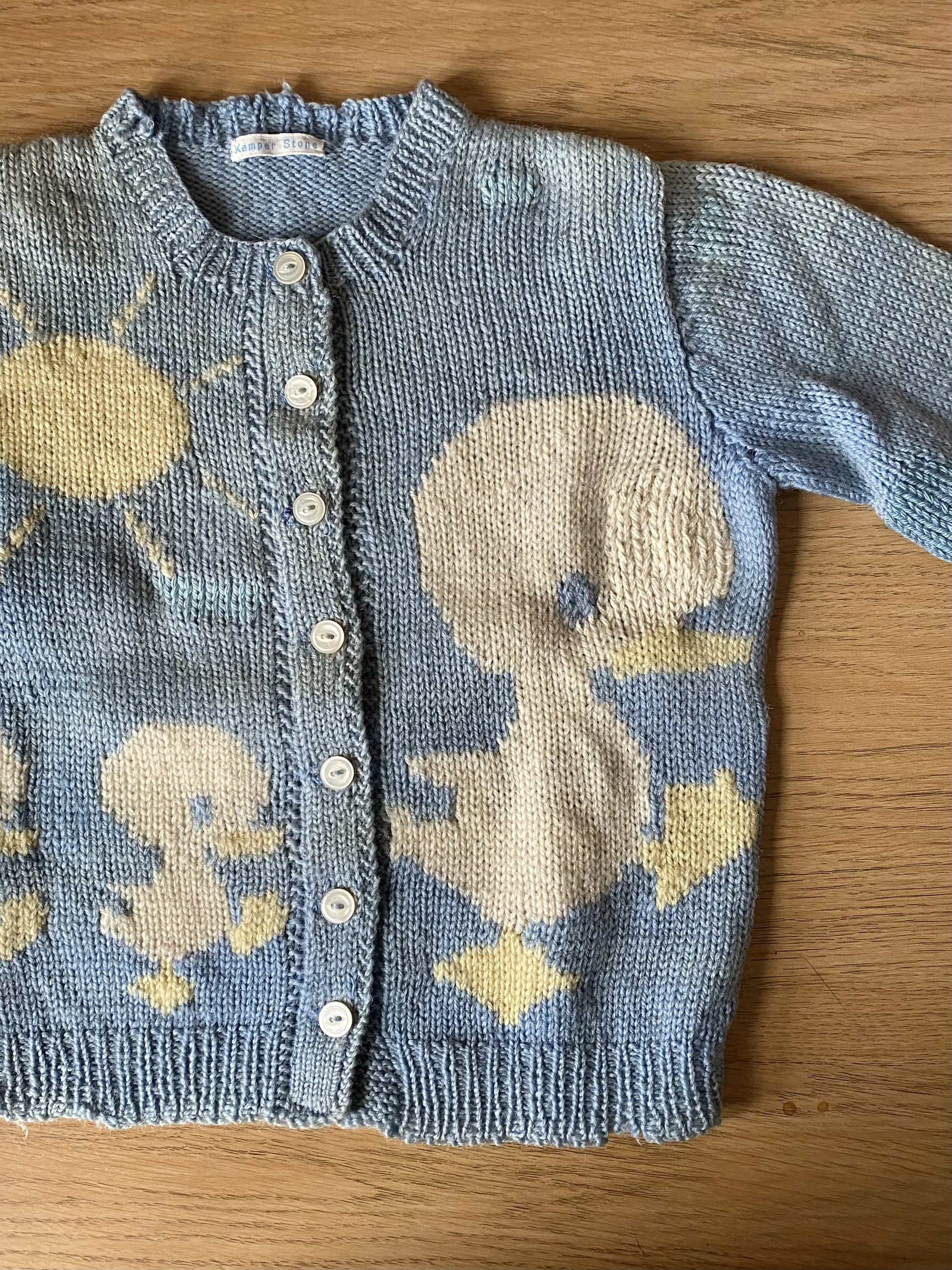Almost invisible repair of vintage children's cardigan, using Swiss darning in almost colour matched yarn