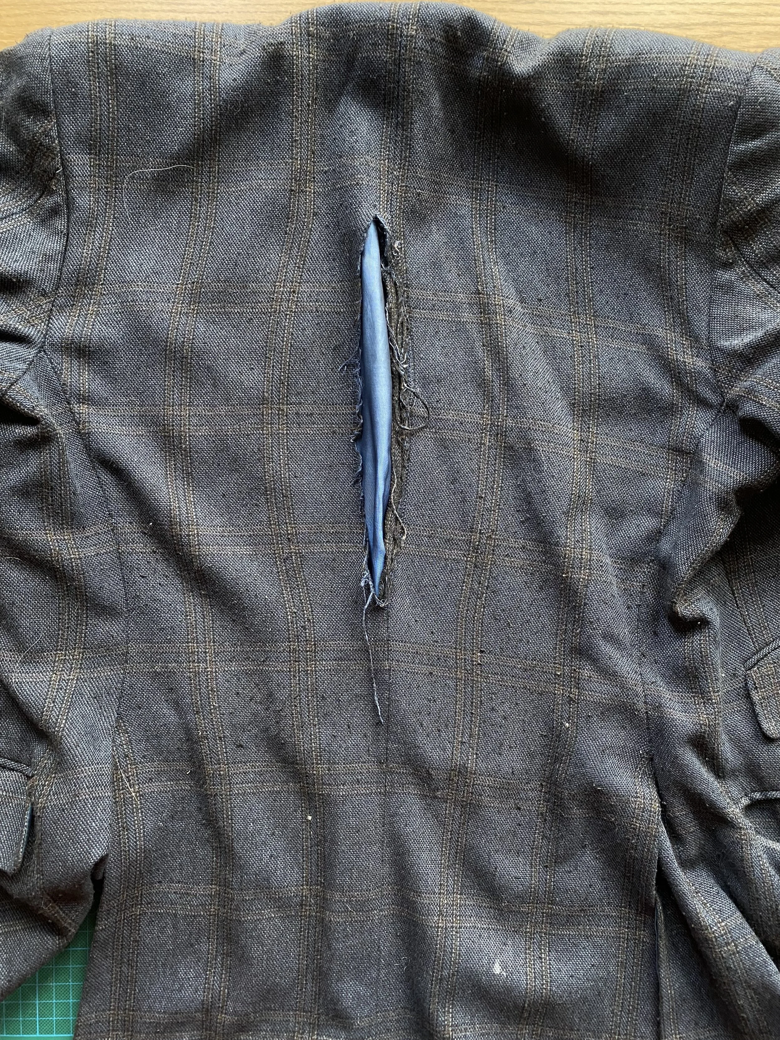 Damaged back of wooden blazer: Before pic of tear down back seam