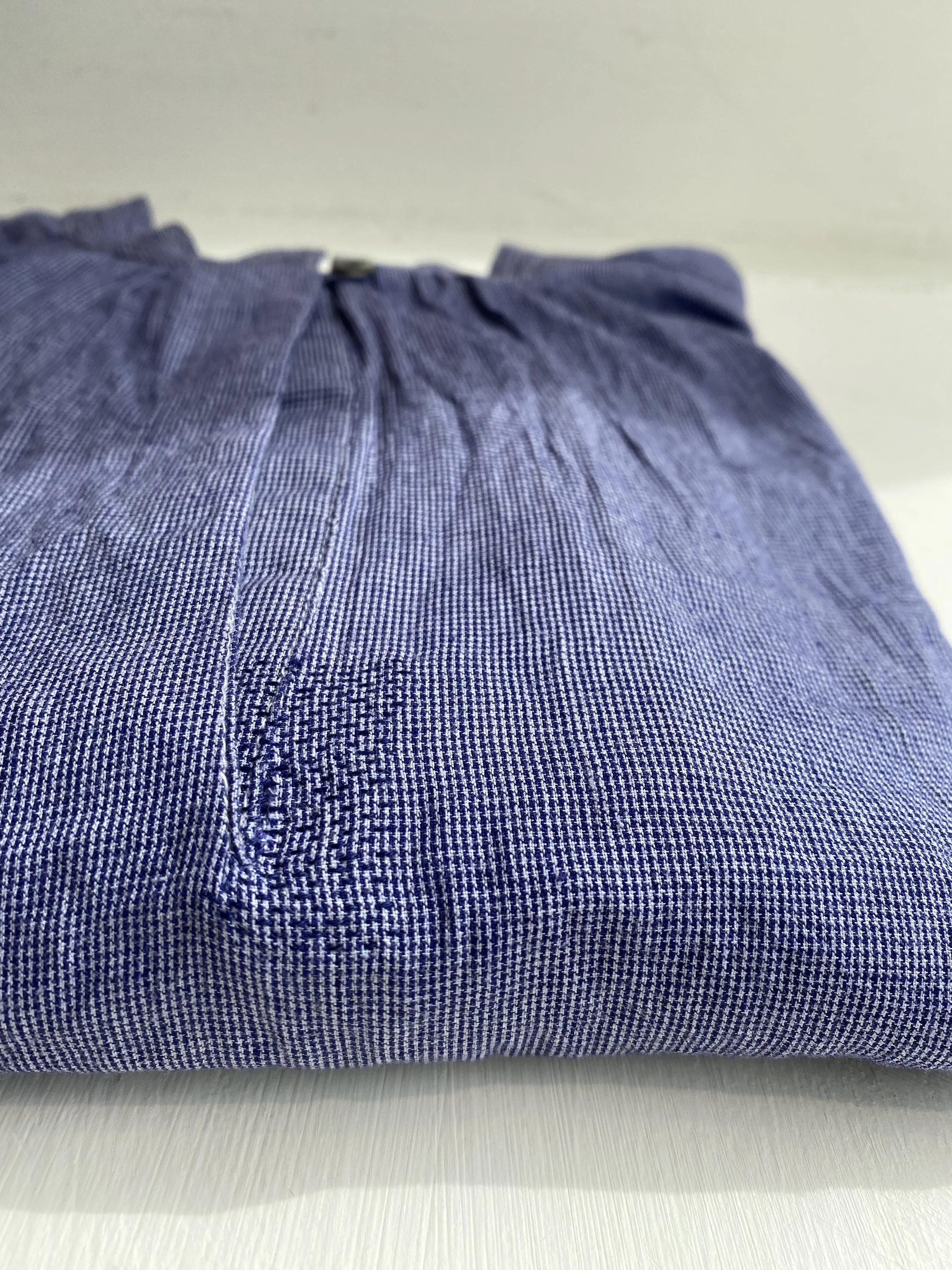 Discreet repair on blue micro check blouse, sashiko style stitched patch (patch on inside - not visible) - stitches in matching blue thread.