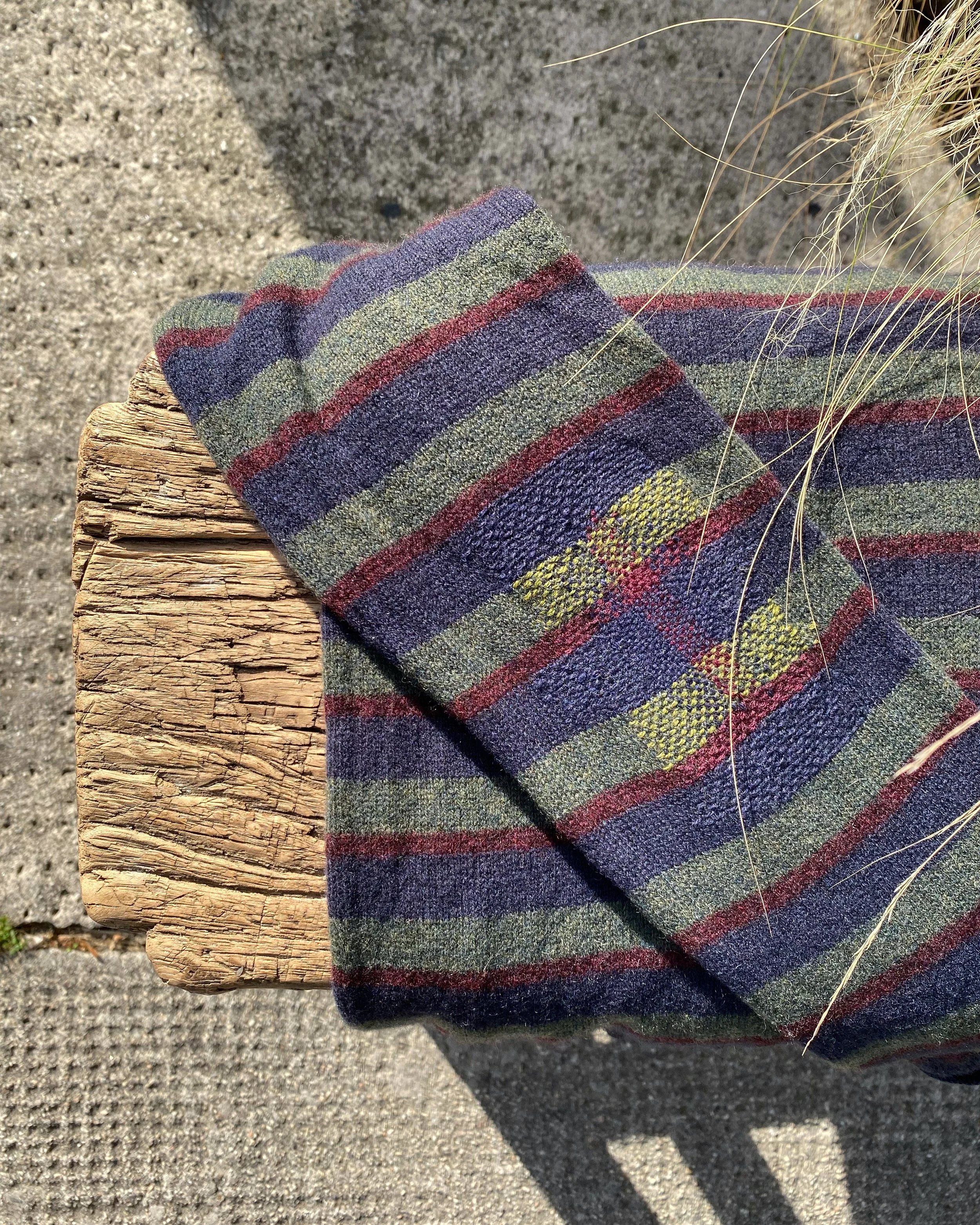 Discreet mend, woven darn on knitted jumper elbow in almost colour matched yarns