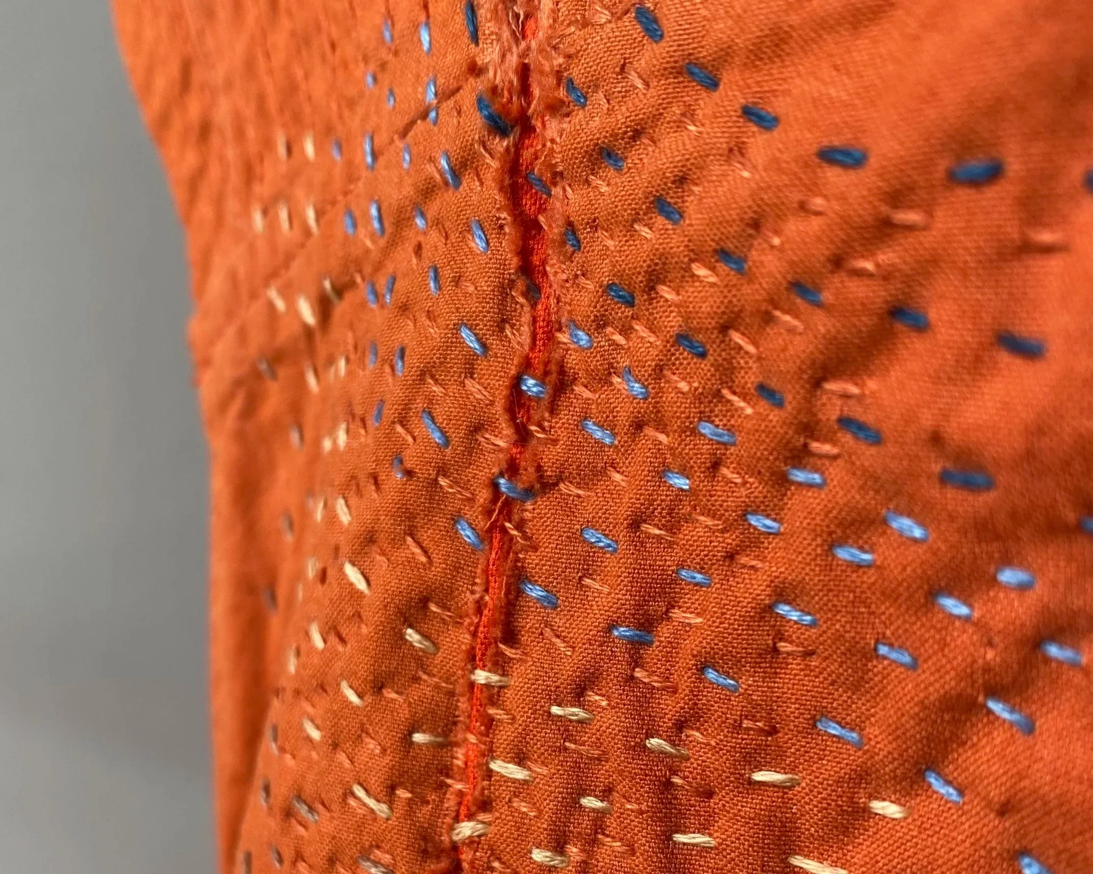 Visible sashiko repair on cotton jumpsuit