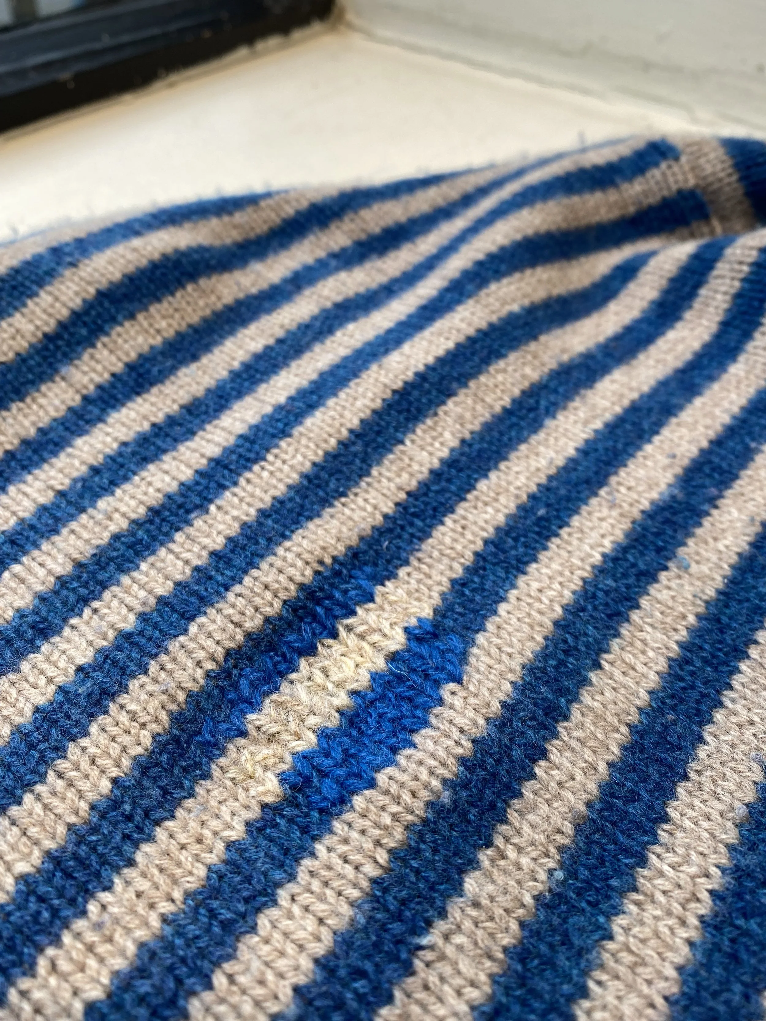 Discreet repair on knitted jumper, Swiss darn in almost matching colours