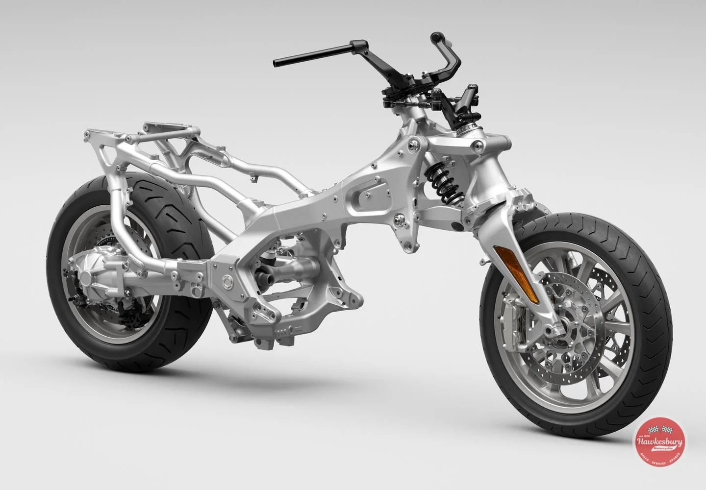 A partially assembled motorcycle frame with visible wheels, suspension, and brake disc, on a plain background with a Hawkesbury Motors logo in the bottom right corner.