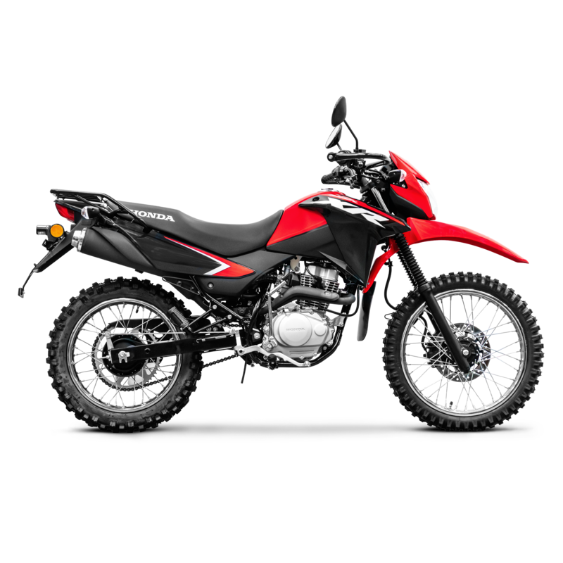 Red and black Honda off-road motorcycle with knobby tires and a windshield.