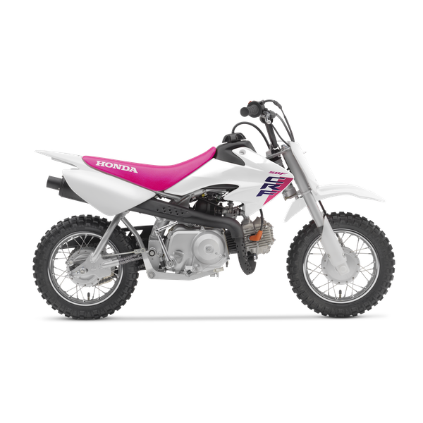 A white Honda dirt bike with pink and purple accents, featuring knobby tires, a pink seat, and a black exhaust pipe.