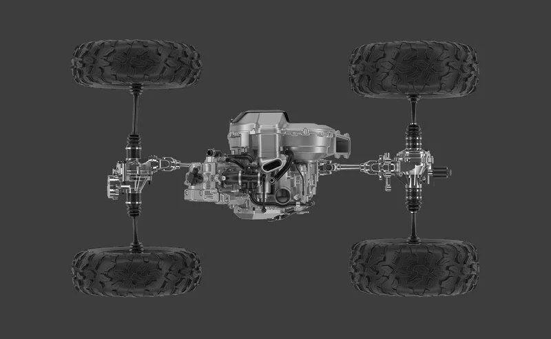 View of a robotic vehicle chassis with four large wheels and an exposed central motor and mechanical parts against a gray background.