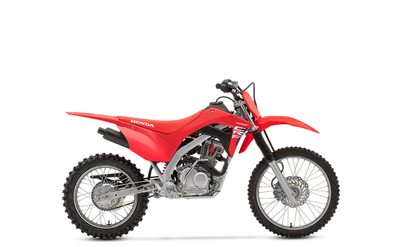 A red Honda dirt bike motorcycle with black and gray accents, knobby tires, and a visible engine, photographed against a plain background.