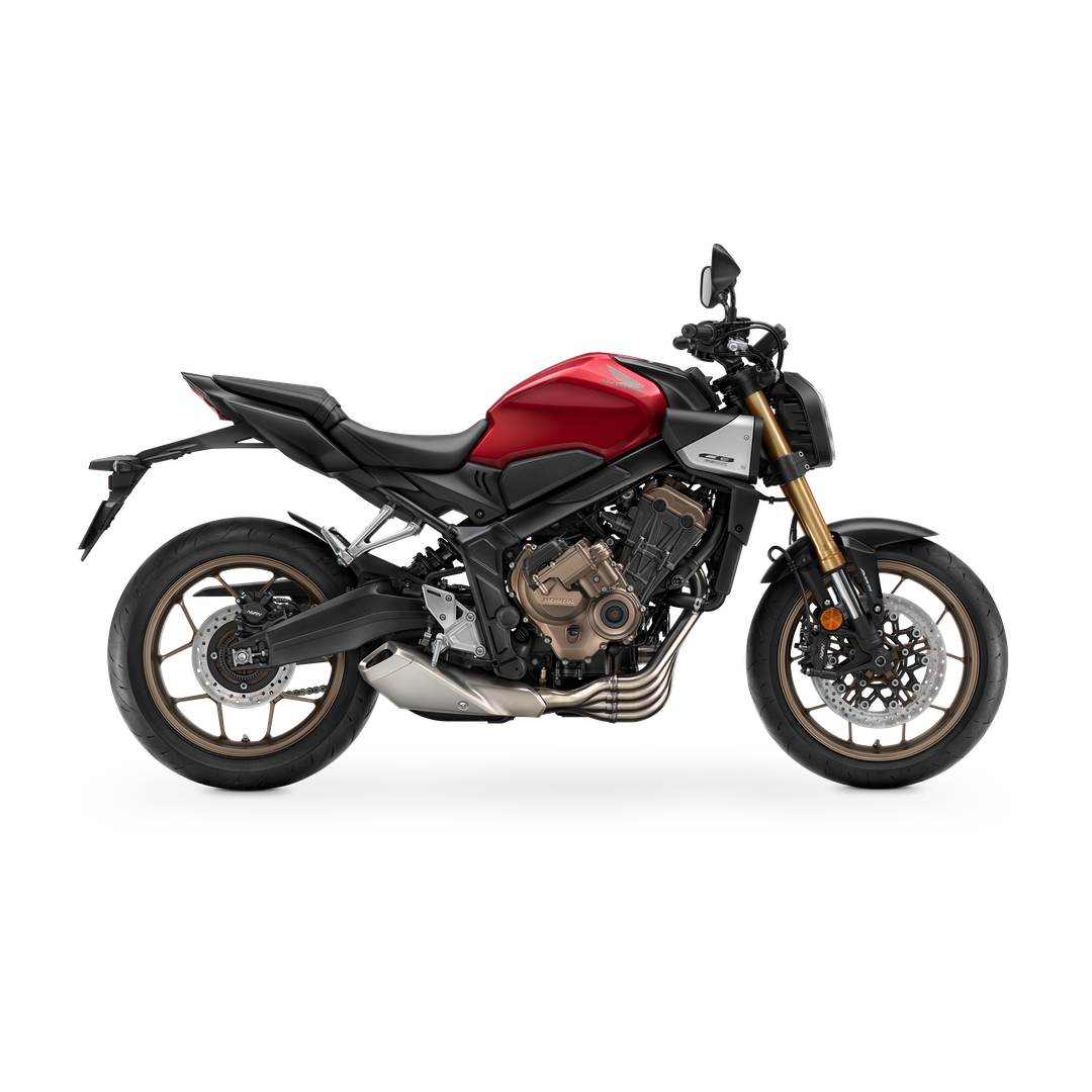 Red and black motorcycle with gold front forks and exhaust system, featuring a detailed engine and modern design.