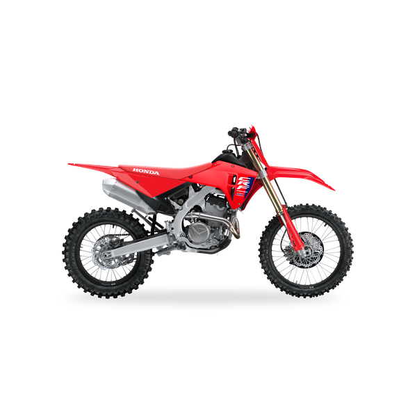 Red Honda dirt bike with black and white accents and knobby tires