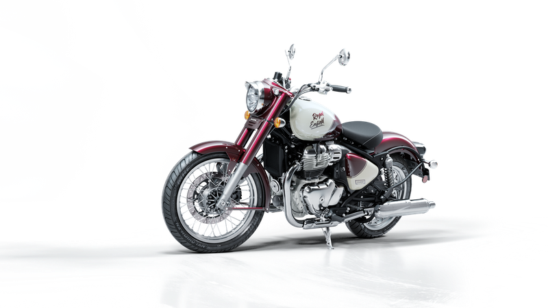A Royal Enfield motorcycle with a white and red gas tank, parked on a plain surface against a black and gray background.