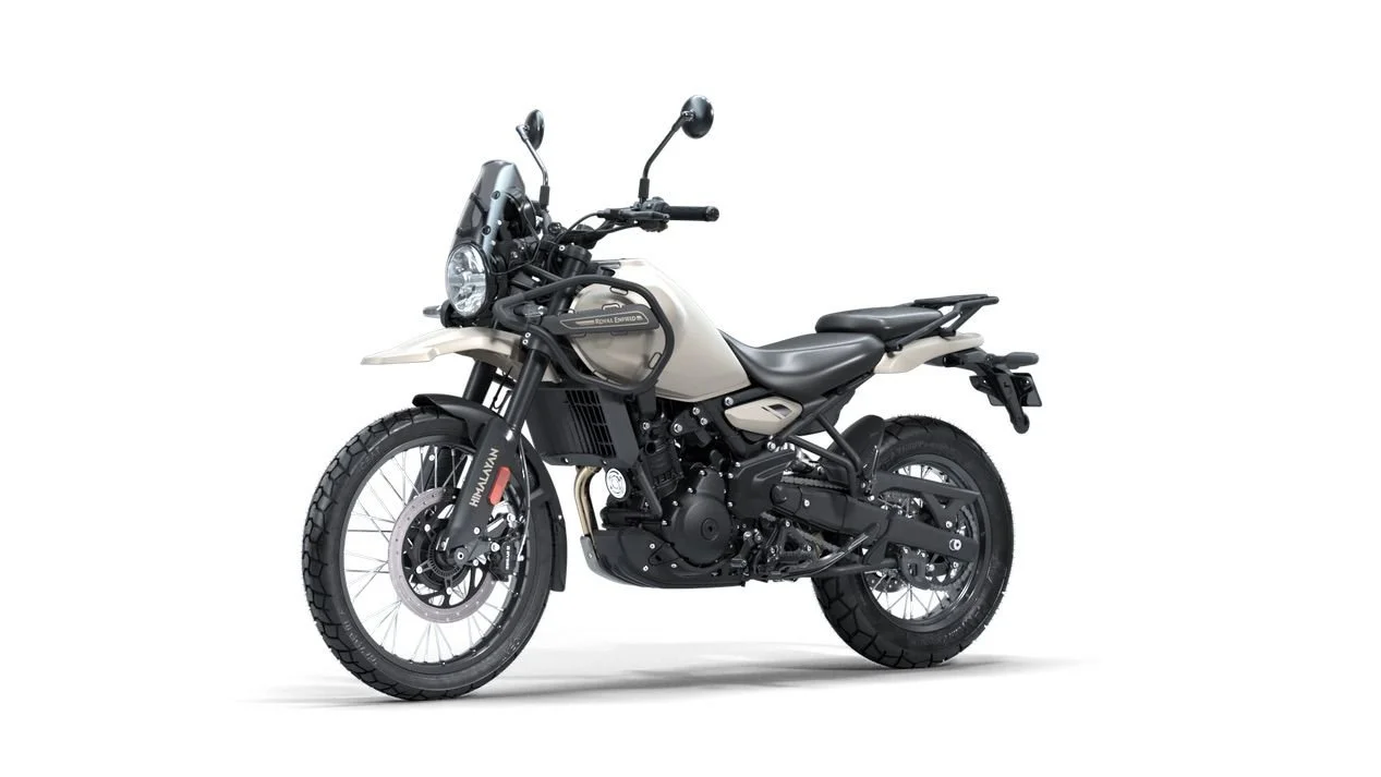 A dual-sport motorcycle with a beige and black color scheme, equipped with off-road tires, a windshield, and a luggage rack.