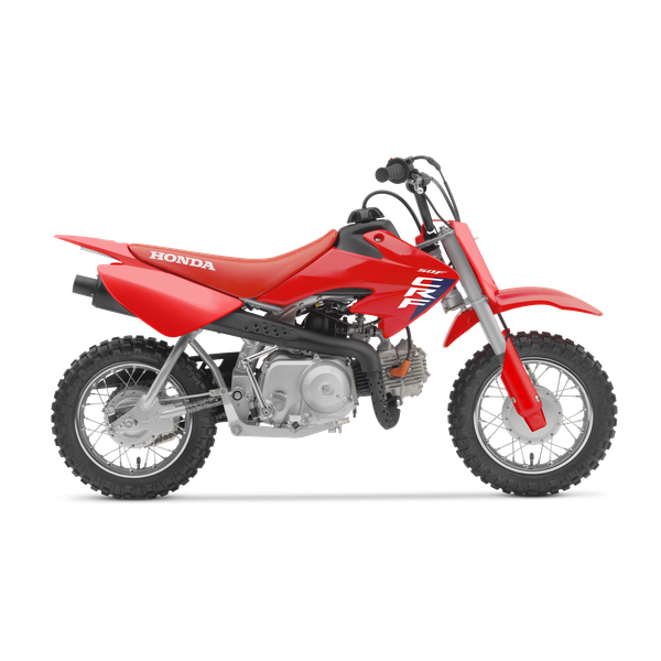 Red Honda dirt bike with black and white decals, knobby tires, and an exhaust pipe.