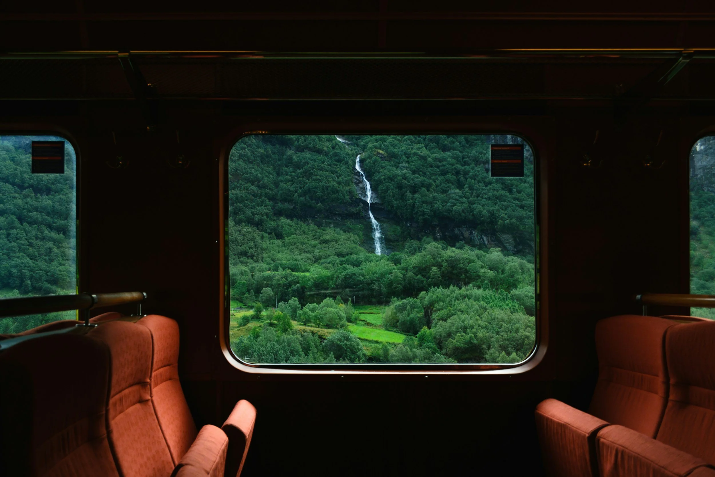 Scenic train journey through Norway’s fjord landscape, ideal for high-end Nordic travel itineraries