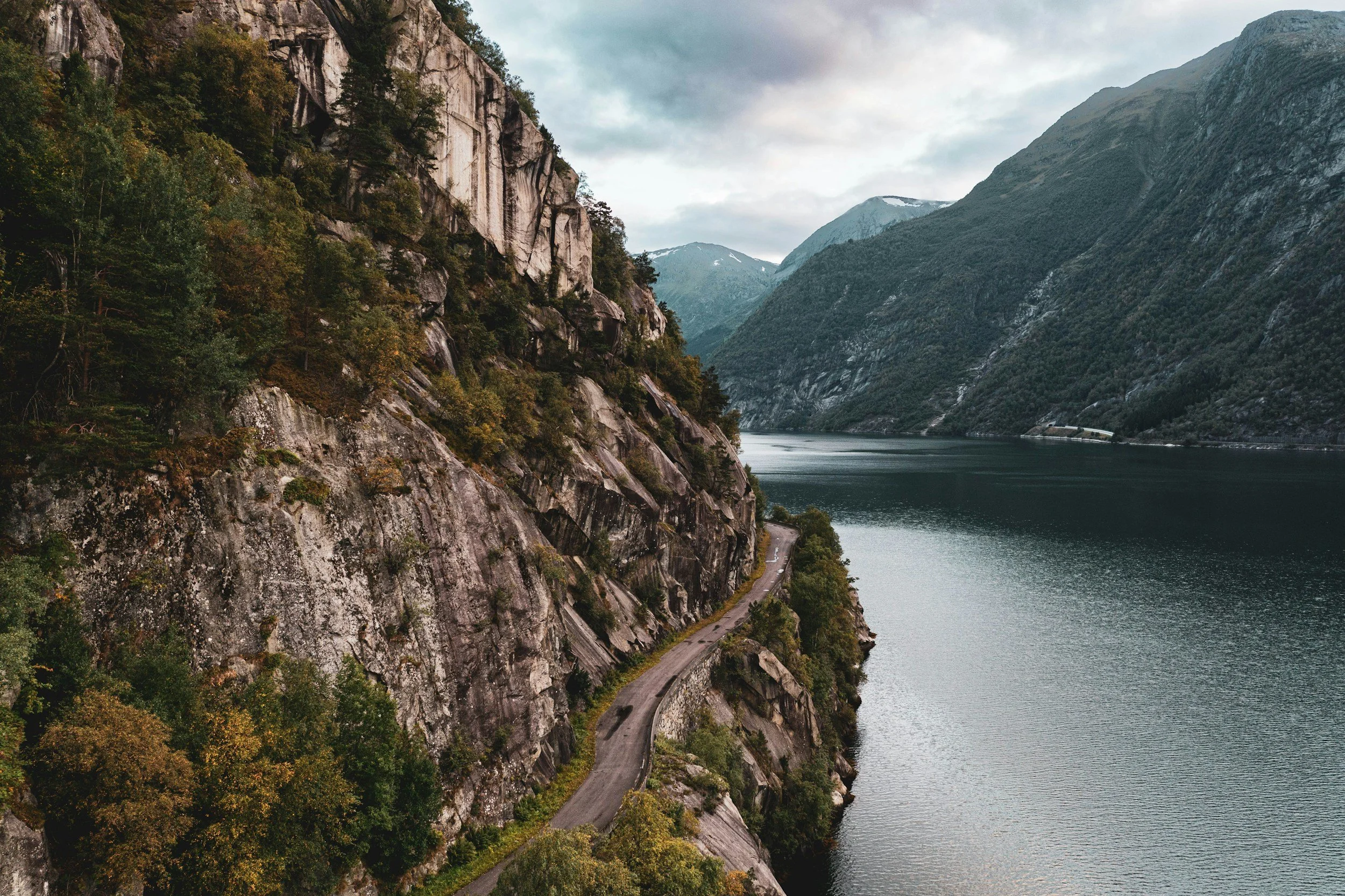 Steep Norwegian fjord landscape highlighting the importance of careful route planning for high-end Nordic travel.