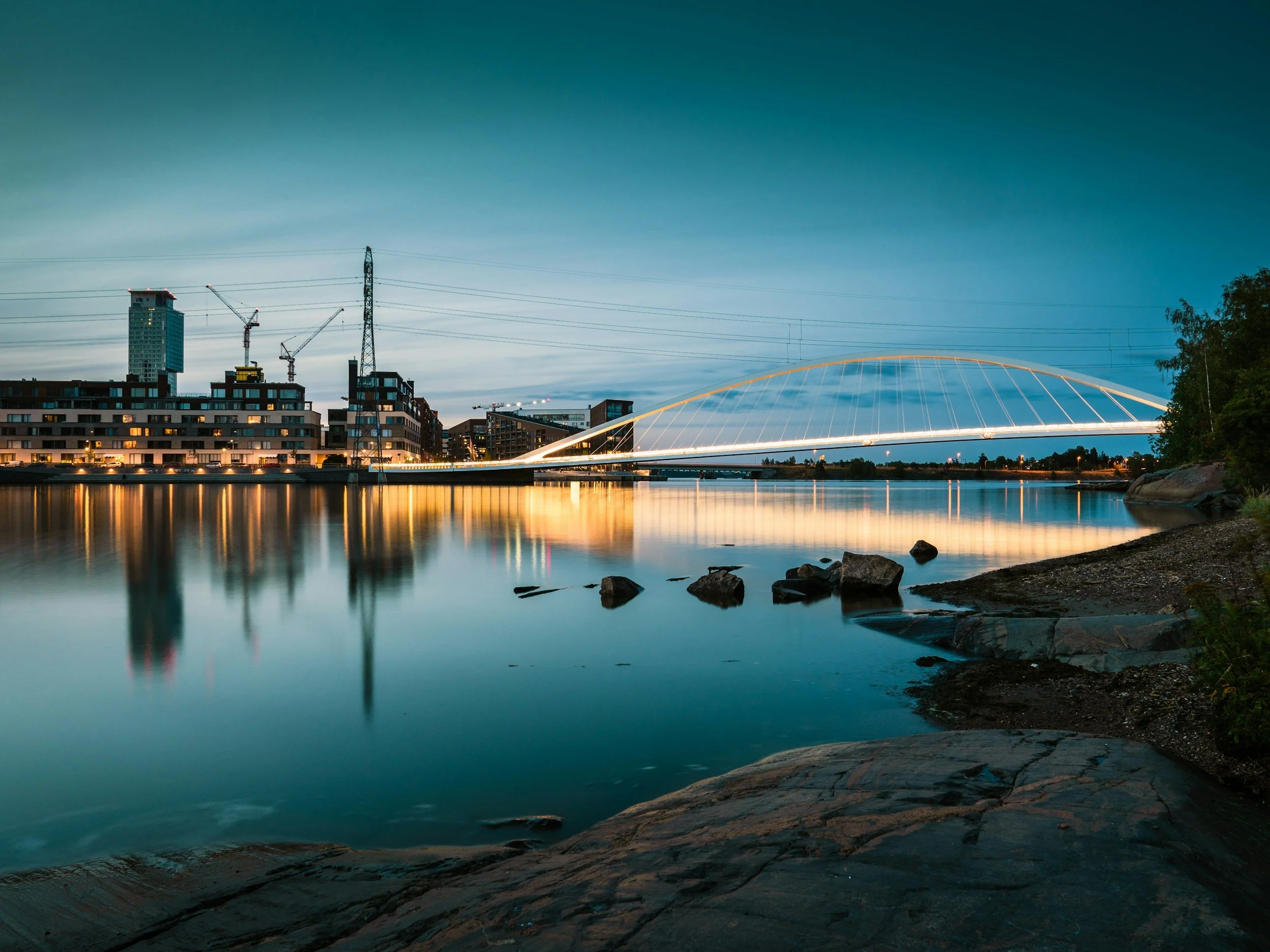 Modern Helsinki waterfront at evening light, showing design, architecture, and calm Nordic city atmosphere