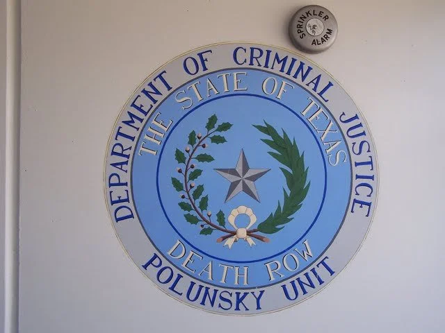 State seal outside the entrance to 12 building.