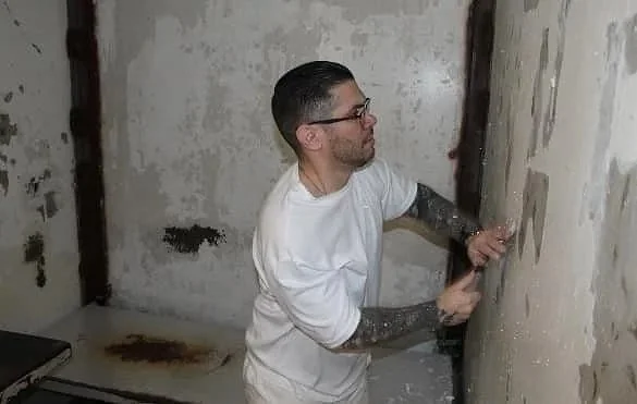 Field Minister Gary painting a Death Row cell.