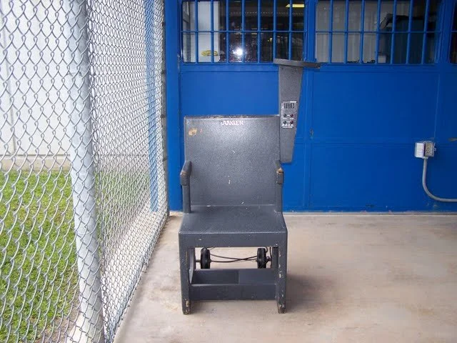 This is the B.O.S.S. chair. Basically a metal detector to see if a person is holding a weapon in their, uh, butt.
