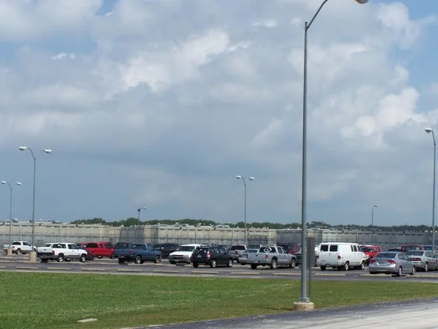 If you look into the distance, you will see some large cell block buildings. They are 4 and 3 buildings, which house population inmates. Whereas 12 building houses inmates individually, these buildings house two inmates per cell.