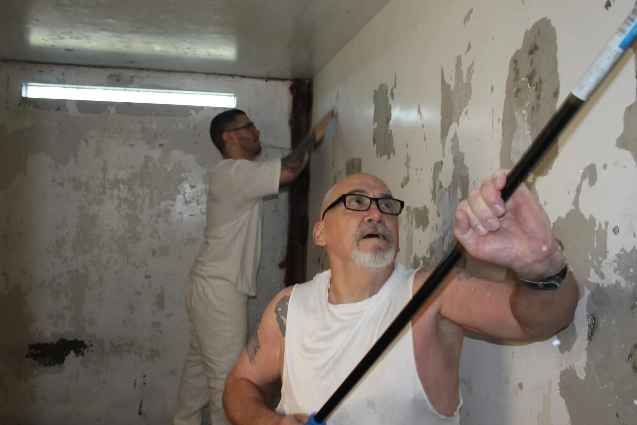 Field ministers, life coaches, and the self-harm team all pitching in to paint Death Row cells. These images are provided by Death2Life Prison Ministries.
