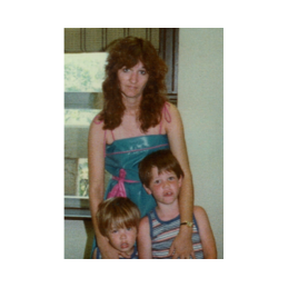 The brothers with their biolgical mother on their adoption day.