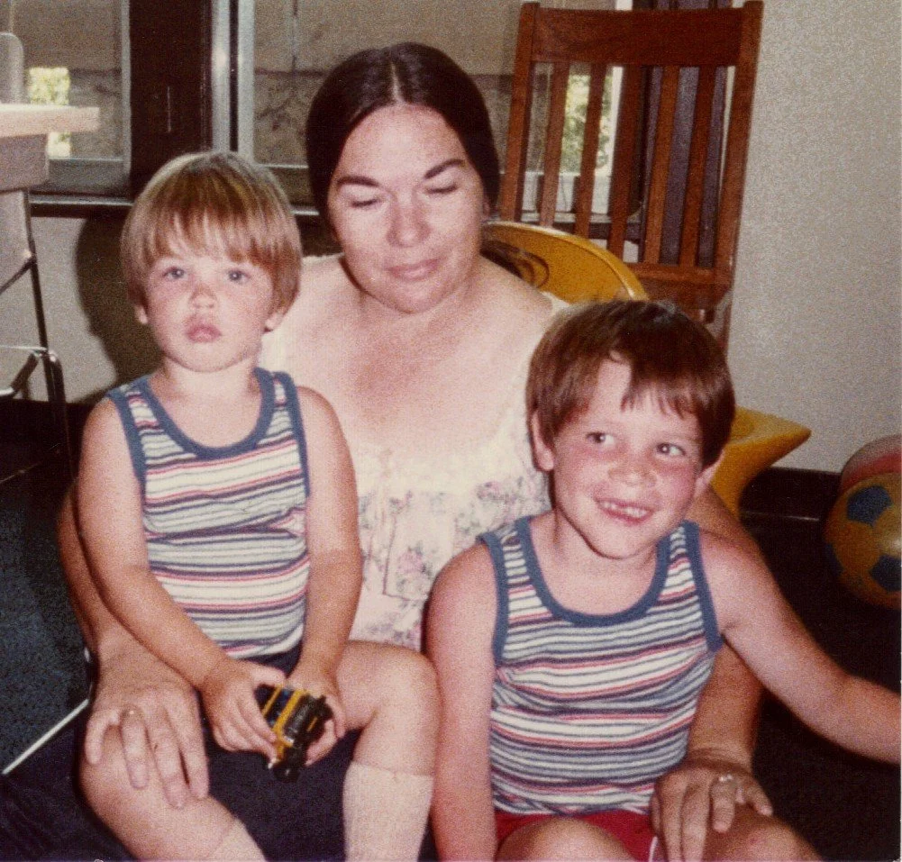 Randy with his biological brother, Wesley, on their adoption day. We don't know the woman in the picture.