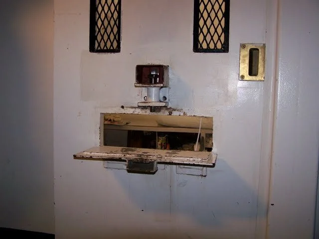 This is the food or 'bean' slot that they use to feed us through or place handcuffs on.