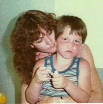 Randy, with his biological mother on his adoption day.
