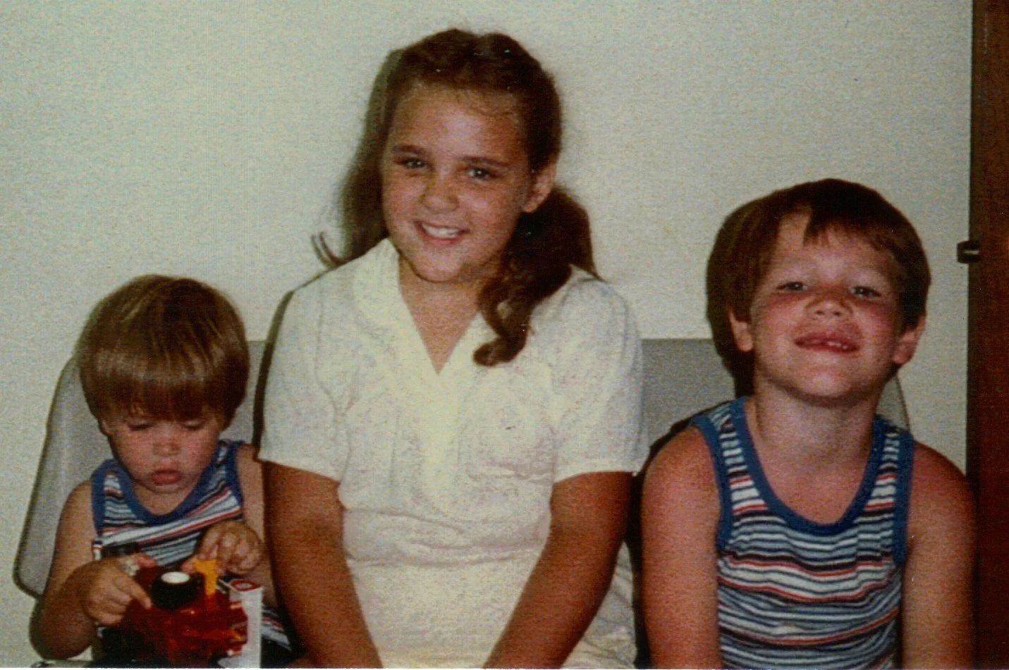 Randy and Wesley on their adoption day. We don't know who the little girl is, but probably one of the other kids from the foster home where the boys were living prior to their adoption.