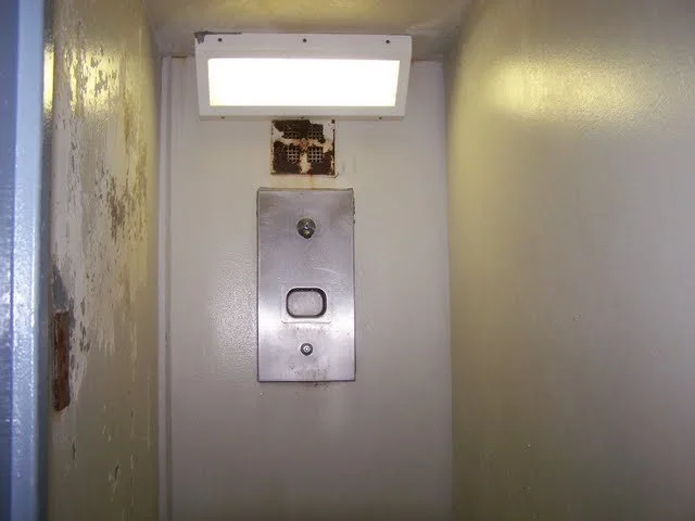 This is where we shower. They lock the inmate in. On each pod there are two showers for each section, one upstairs and one downstairs, for a total of 12 showers on each pod. You can't see it in the picture, but the shower door is heavy stainless stee