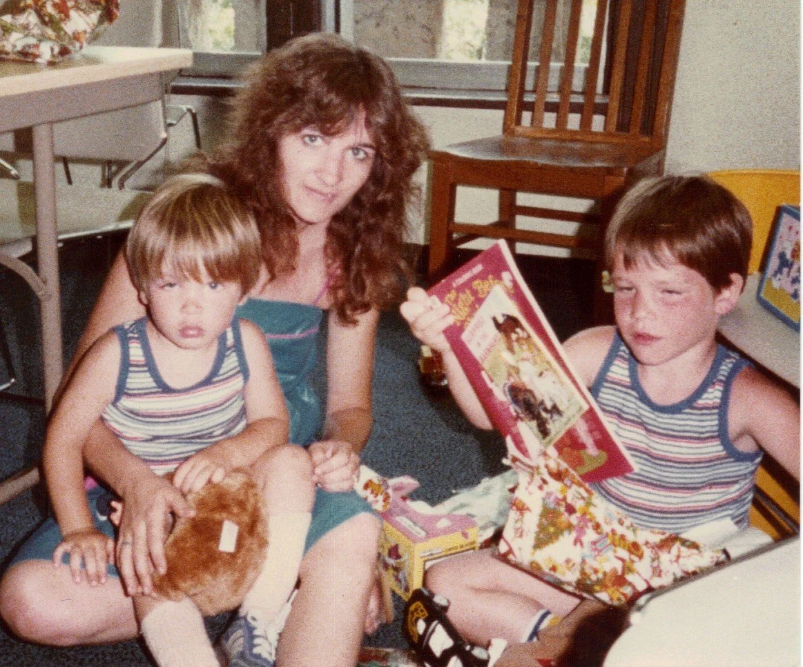 Randy (on the right) and his biological brother, Wesley, together with their biological mother on their adoption day.