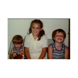 Randy and Wesley on their adoption day. We don't know who the little girl is, but probably one of the other kids from the foster home where the boys were living prior to their adoption.